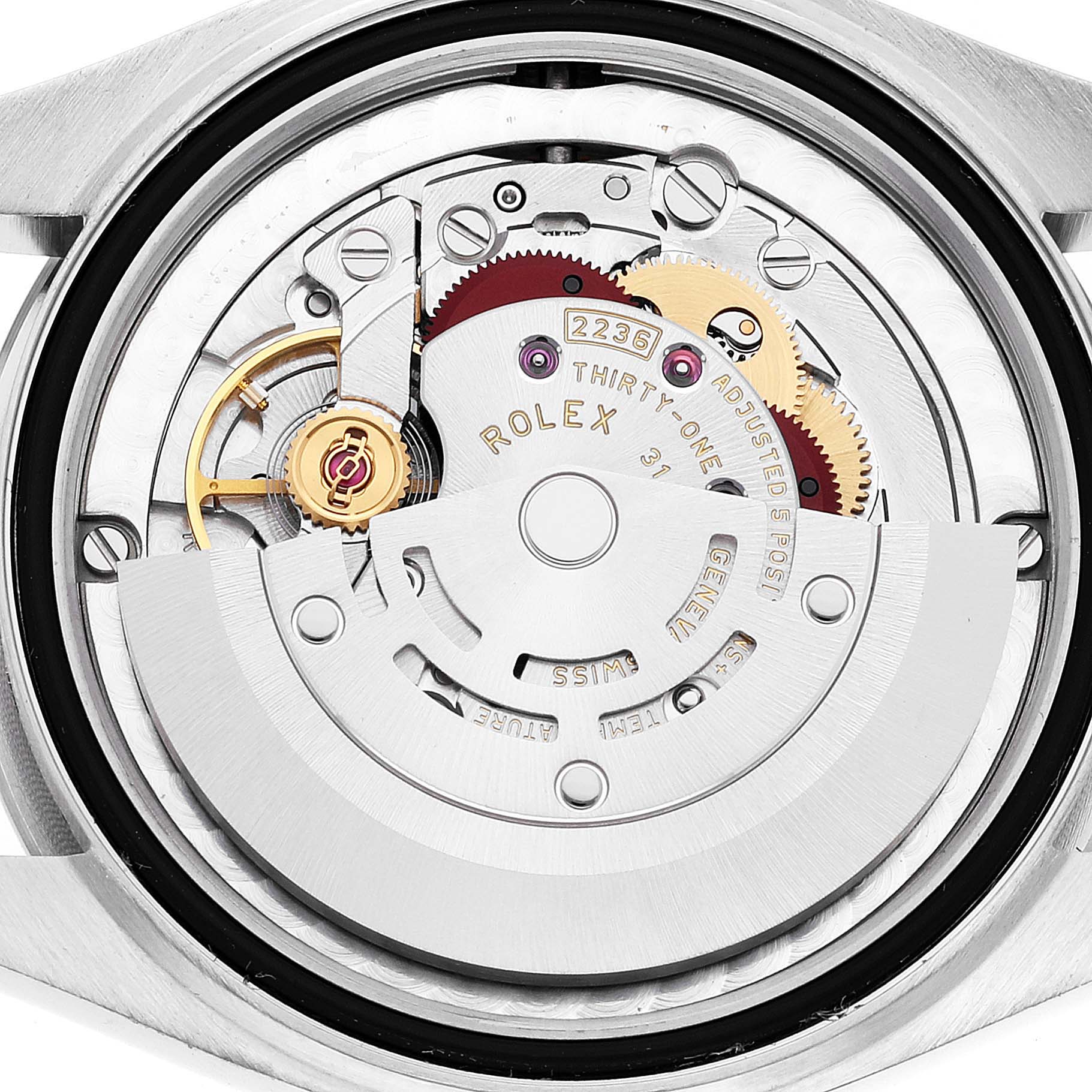 The image shows the internal mechanism from the back of a mid-size Rolex watch, highlighting its intricate components.