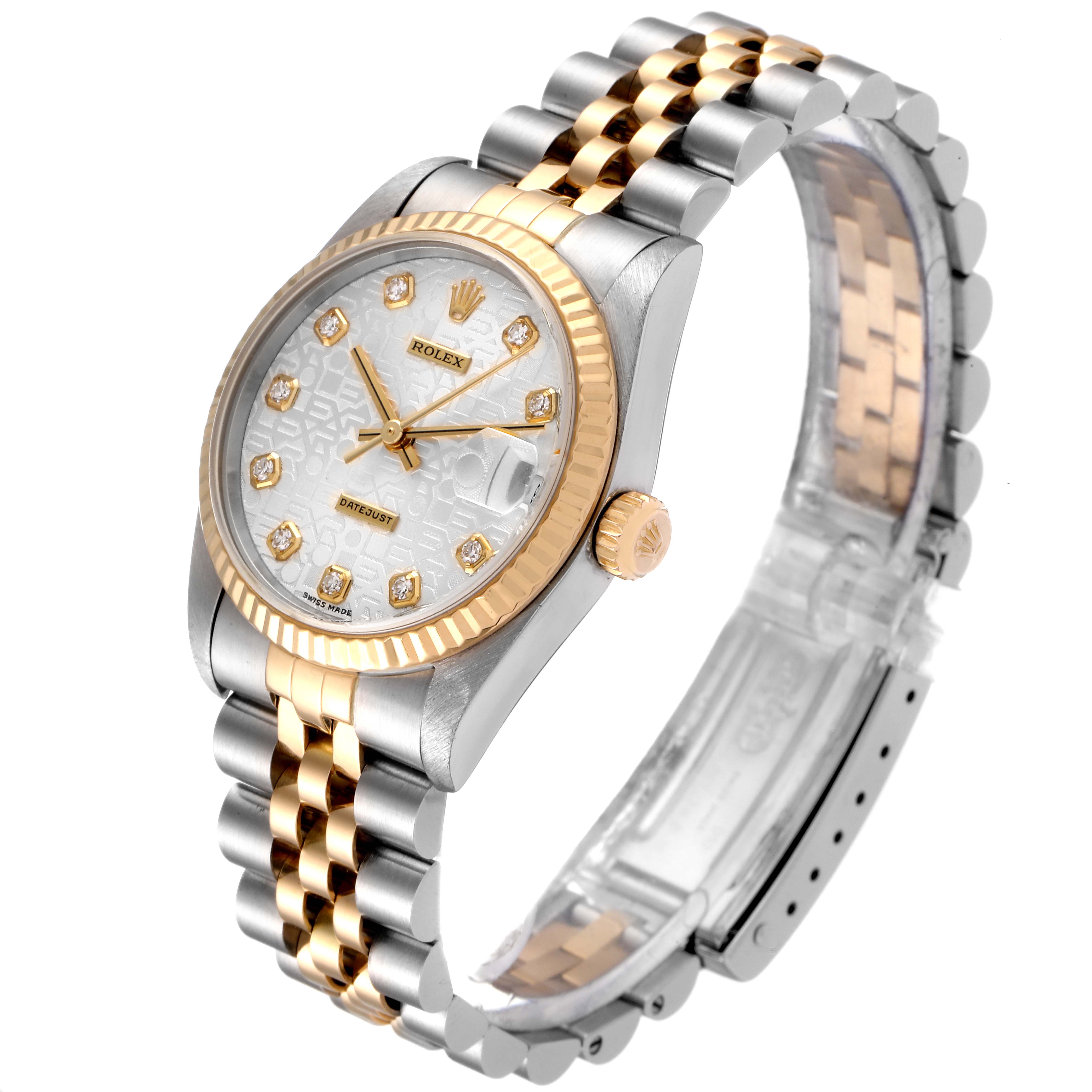 The image shows a Rolex Mid-Size 78273 Women
s Steel and Gold (two tone) Silver Dial 78273 Women
s Steel and Gold (two tone) Silver Dial watch from a tilted angle, highlighting its two-tone bracelet, fluted bezel, and diamond-accented dial.