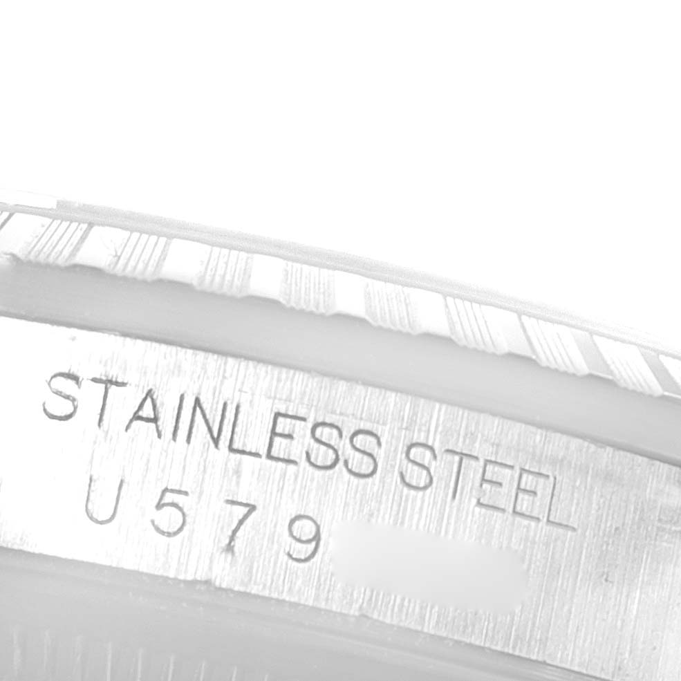 The image shows a close-up view of the stainless steel case side with the serial number engraved, from the Rolex Datejust 16220 Men's Stainless Steel Silver Dial 16220 Men's Stainless Steel Silver Dial model.