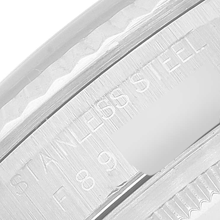 The image shows a close-up of the stainless steel part and engraving on a Rolex Datejust 16234 Men's Stainless Steel Black Dial 16234 Men's Stainless Steel Black Dial watch.