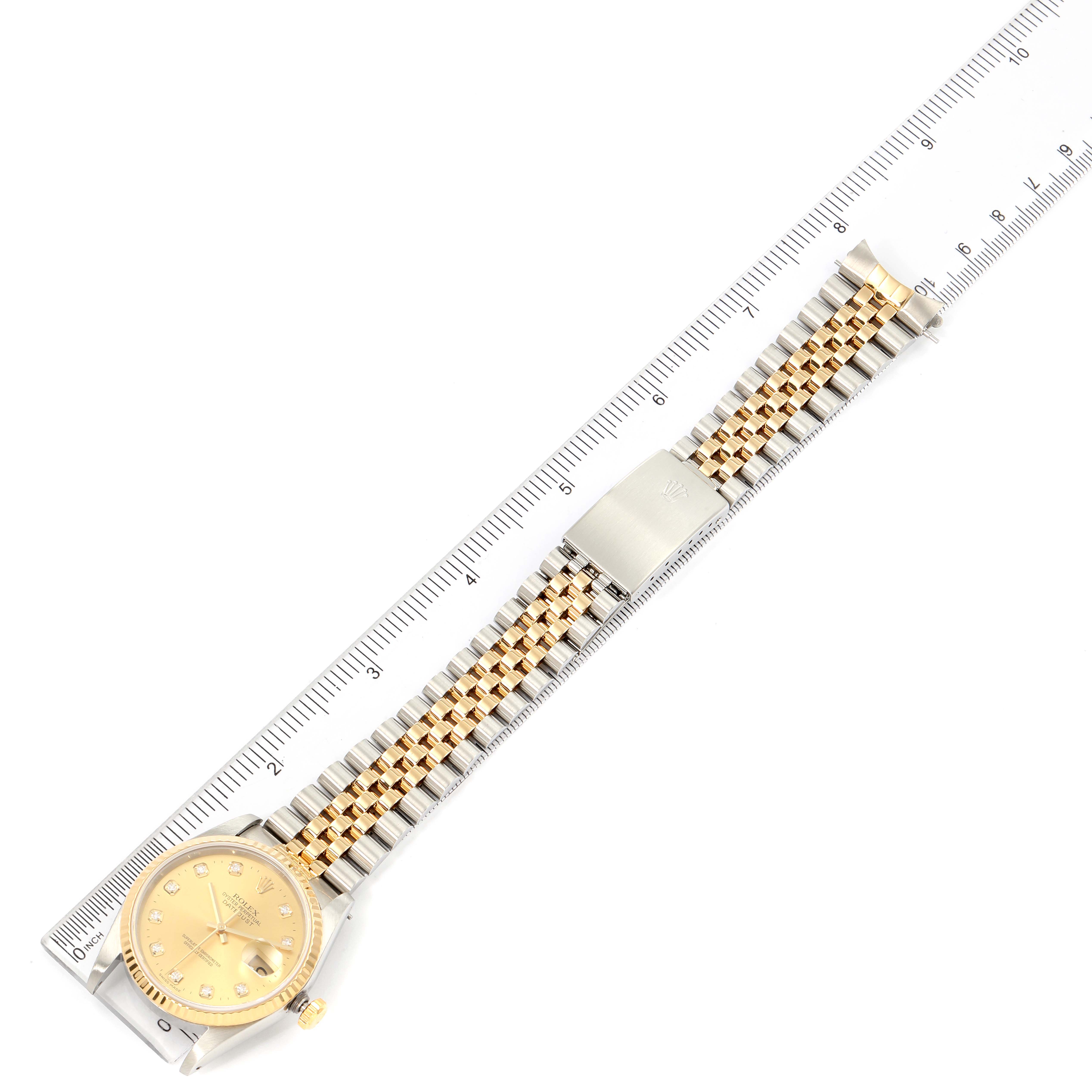 The image shows a Rolex Datejust 16233 Men's Steel and Gold (two tone) Champagne Dial 16233 Men's Steel and Gold (two tone) Champagne Dial watch lying flat, with a ruler to measure its length.