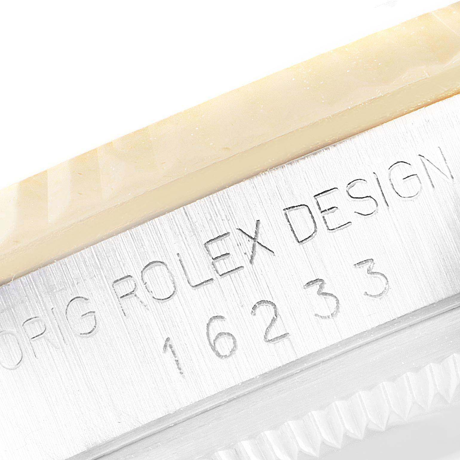 The image shows a close-up of the side of the casing of a Rolex Datejust 16233 Men's Steel and Gold (two tone) Champagne Dial 16233 Men's Steel and Gold (two tone) Champagne Dial model, revealing the engraving "ORIG ROLEX DESIGN 16233."