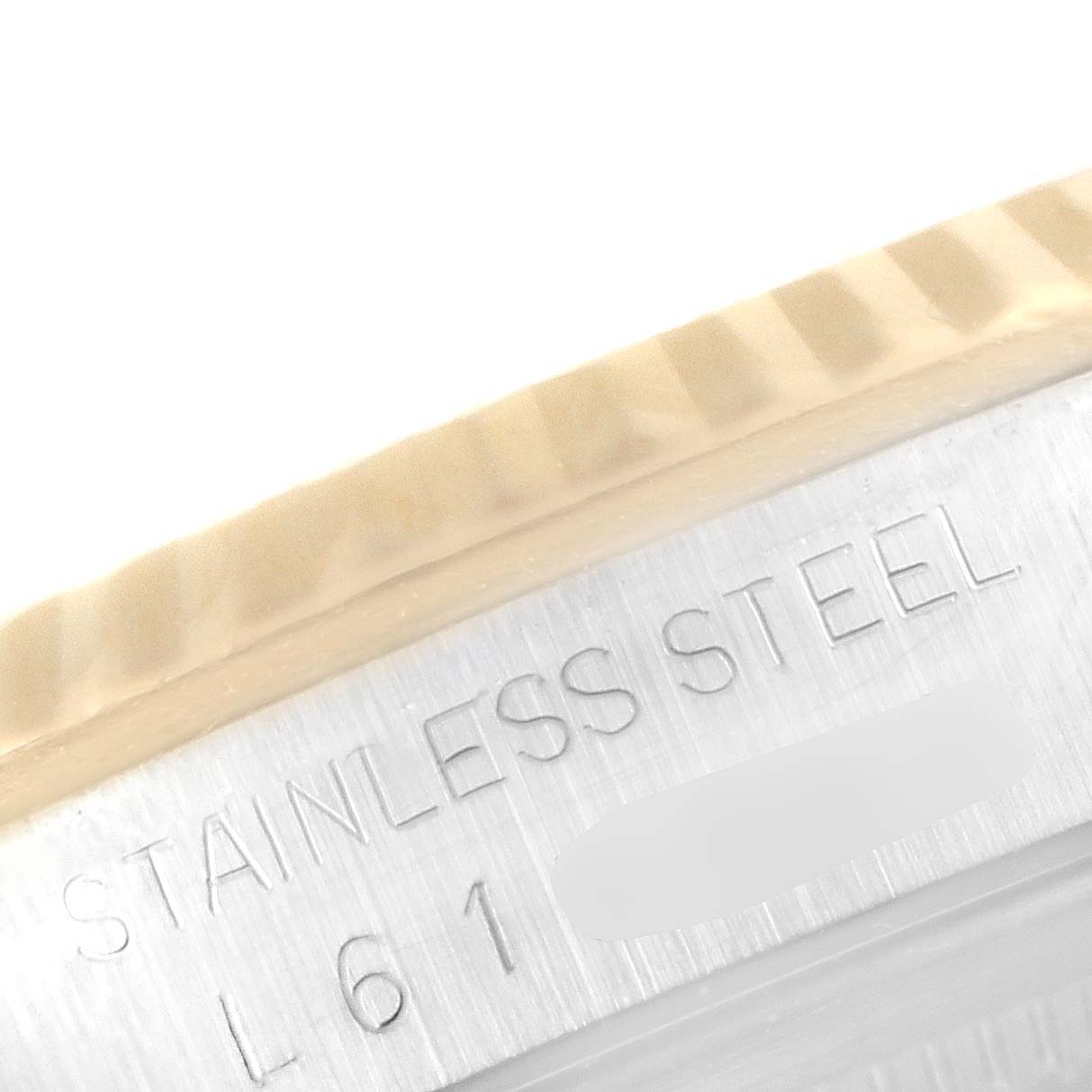 The image shows a close-up of the stainless steel case side of the Rolex Datejust 16233 Men's Steel and Gold (two tone) Champagne Dial 16233 Men's Steel and Gold (two tone) Champagne Dial, highlighting the engraving.