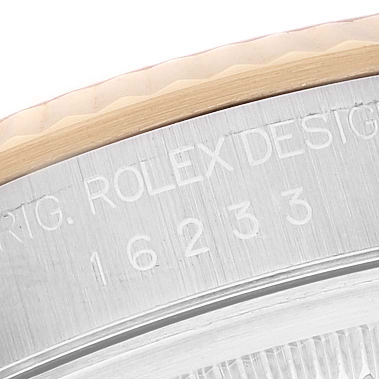 This close-up angle showcases the engraved model number and bezel of the Rolex Datejust 16233 Men's Steel and Gold (two tone) Silver Dial 16233 Men's Steel and Gold (two tone) Silver Dial watch.