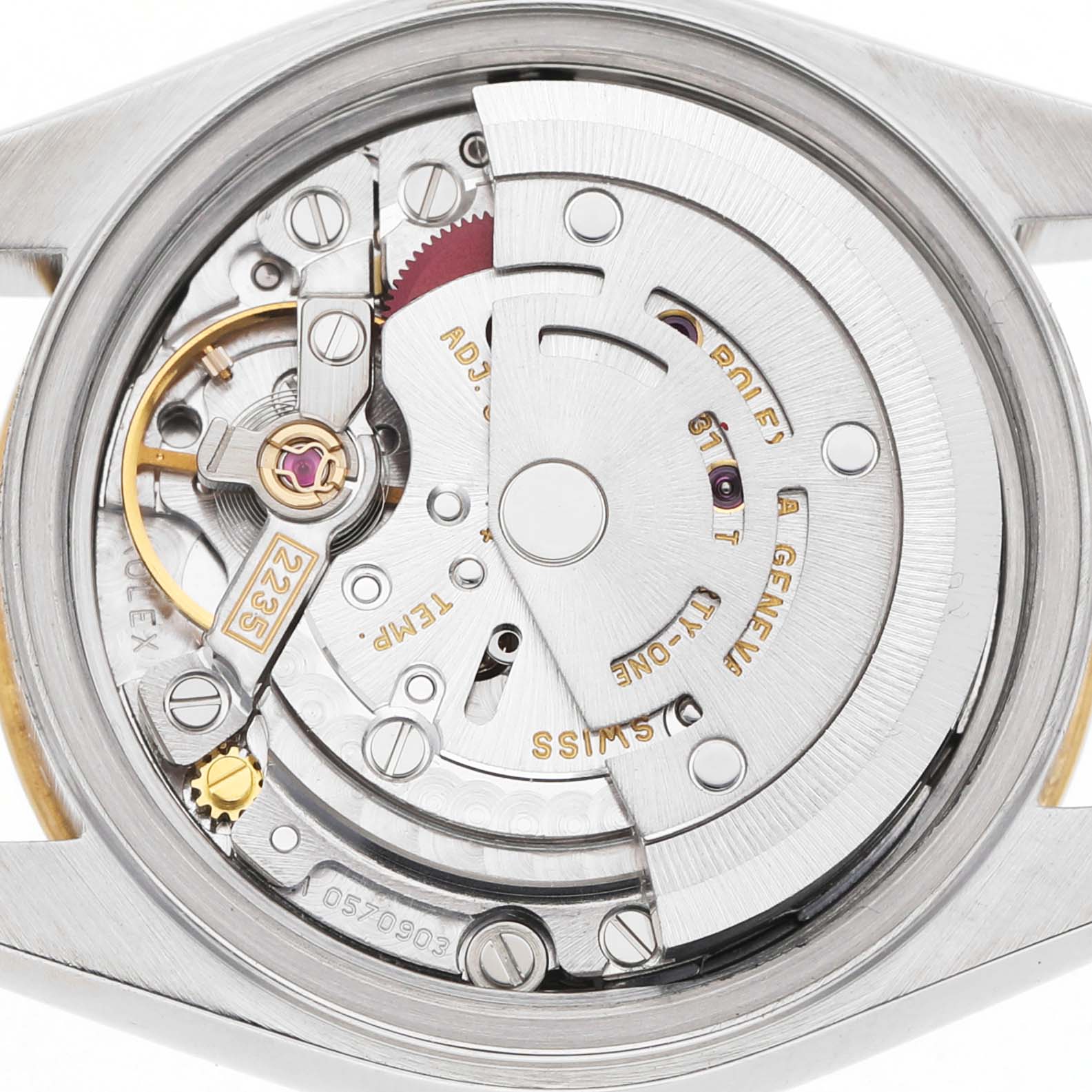 The image shows the movement of a Rolex Datejust 79173 Women's Steel and Gold (two tone) White Dial watch from the back, highlighting its mechanical components.