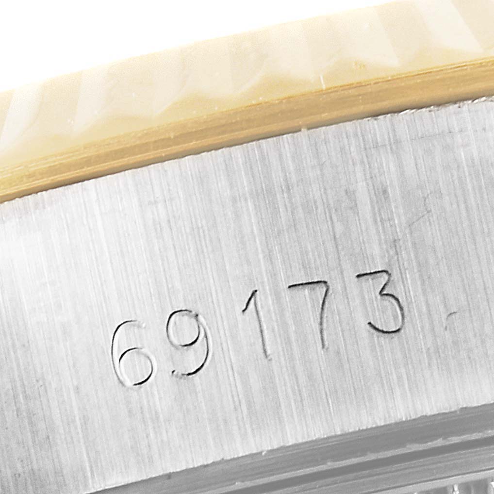 This close-up image shows the model number "69173" engraved on the side of a Rolex Datejust 69173 Women's Steel and Gold (two tone) Silver Dial 69173 Women's Steel and Gold (two tone) Silver Dial watch case.