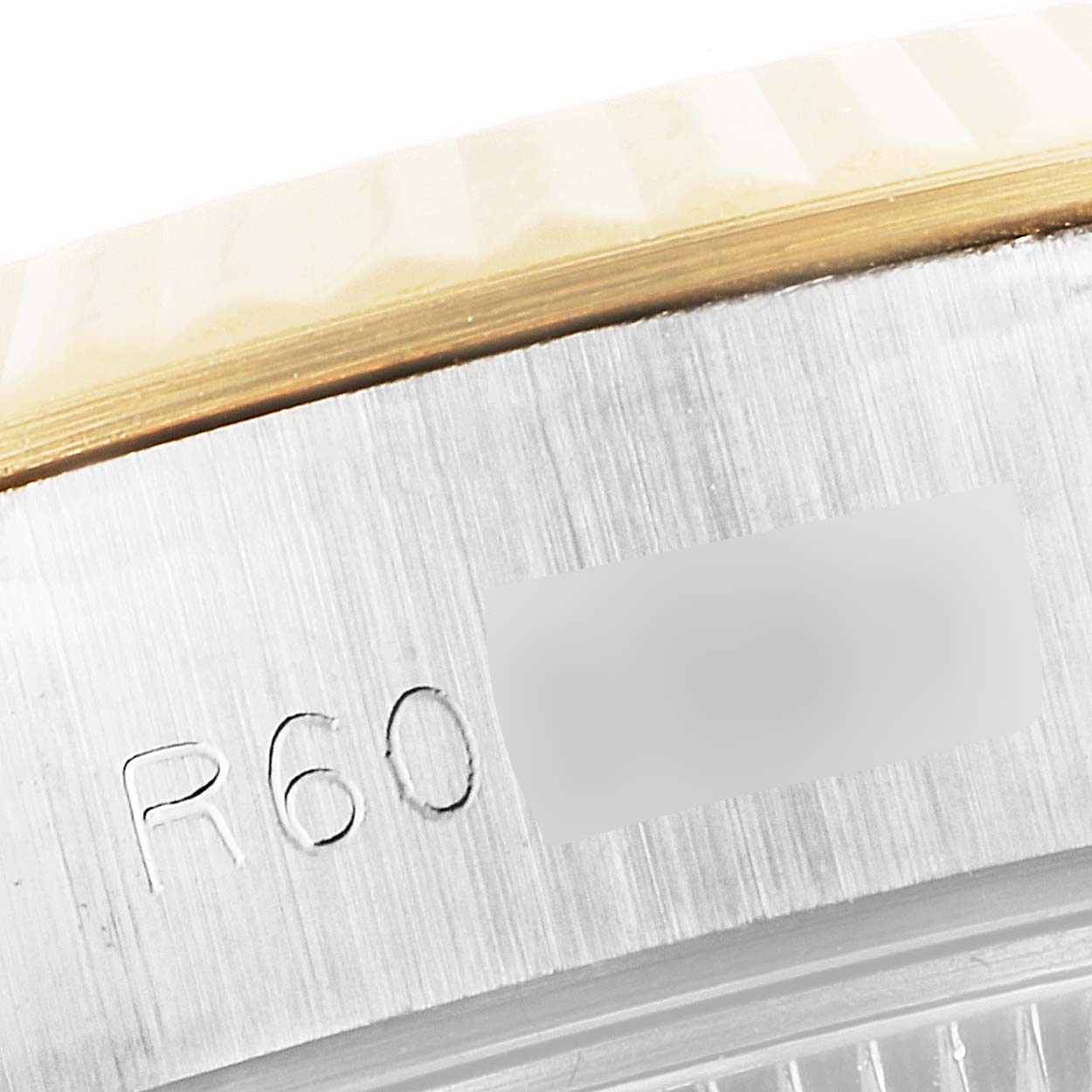 The image shows a close-up of the edge of the bezel and case of a Rolex Datejust 69173 Women's Steel and Gold (two tone) Silver Dial 69173 Women's Steel and Gold (two tone) Silver Dial watch.