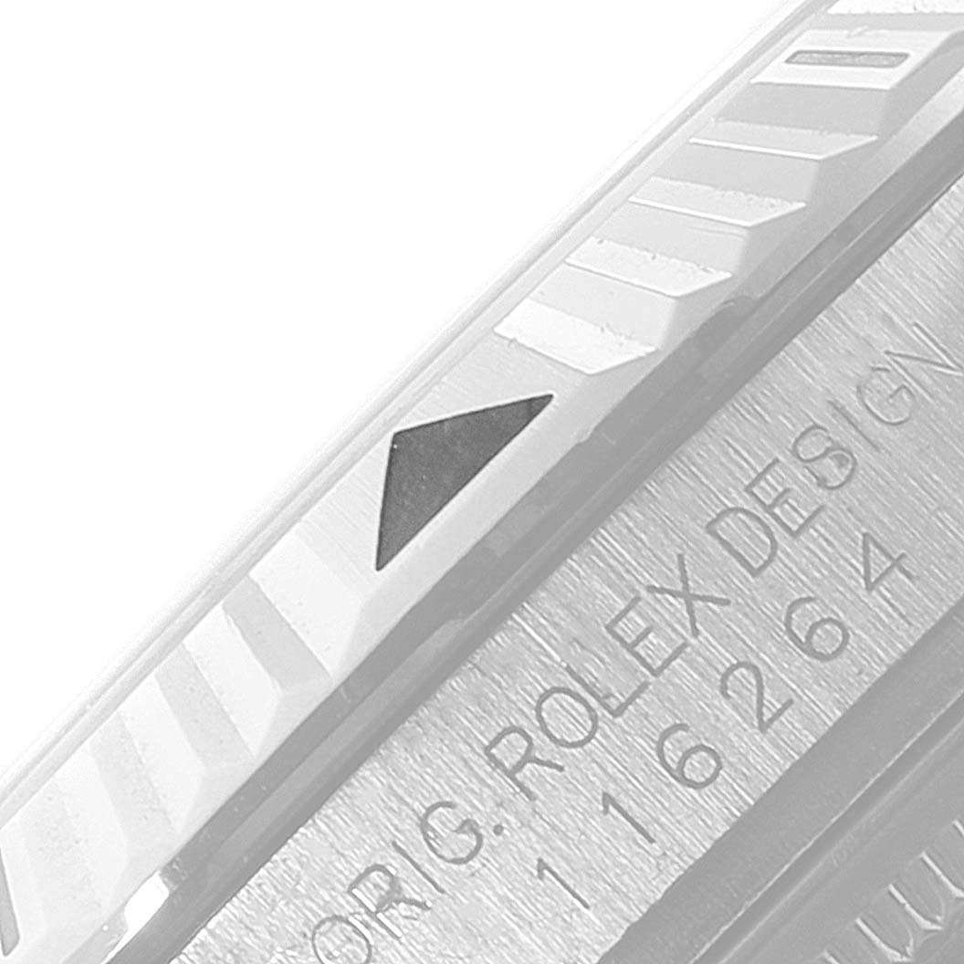 The image shows a close-up of the bezel and part of the case side of a Rolex Turn-o-Graph 116264 Men's Stainless Steel Blue Dial 116264 Men's Stainless Steel Blue Dial watch.