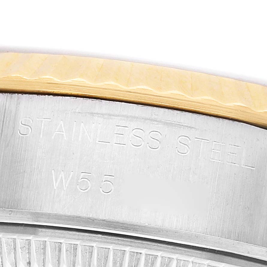 The image shows a close-up of the side of a Rolex Datejust 69173 Women's Steel and Gold (two tone) White Dial, highlighting the stainless steel engraving and part of the bezel.