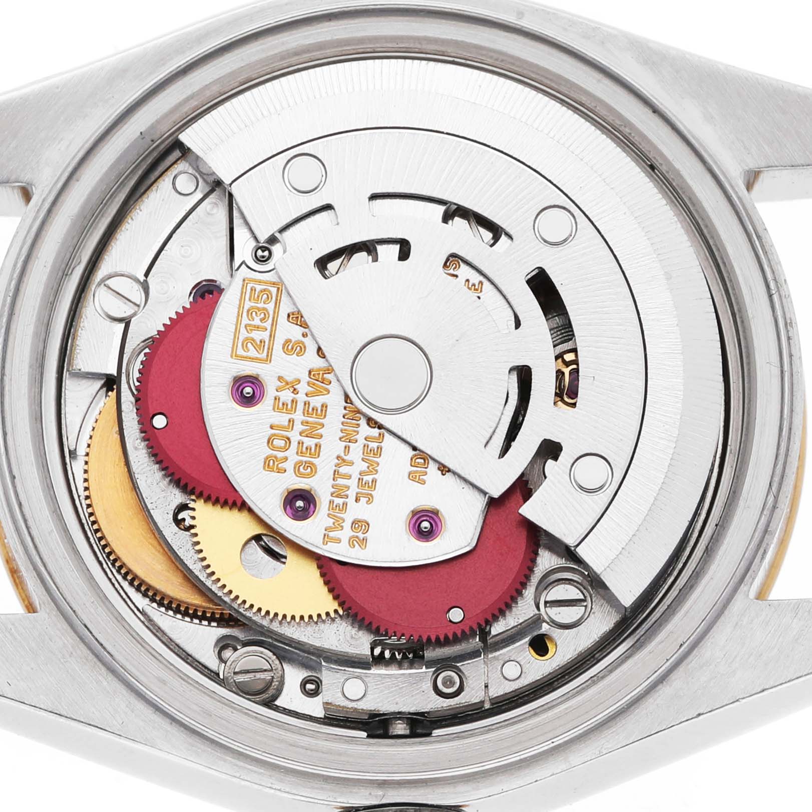 The image shows the movement of a Rolex Datejust 69173 Women's Steel and Gold (two tone) White Dial watch from a top view, revealing its intricate inner mechanisms.