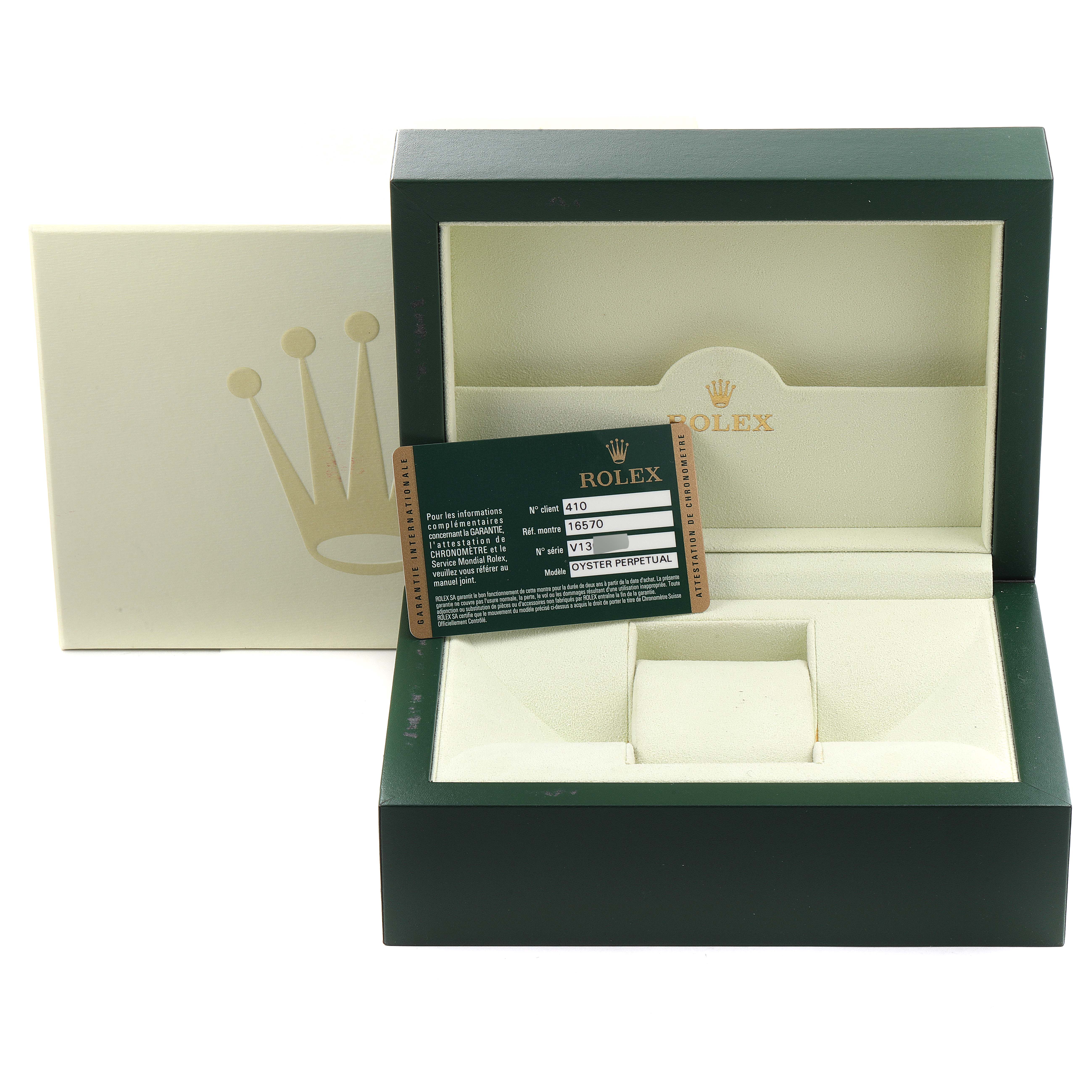 The image shows an empty Rolex Explorer 16570 Men's Stainless Steel White Dial 16570 Men's Stainless Steel White Dial watch box and warranty card at an angled view.