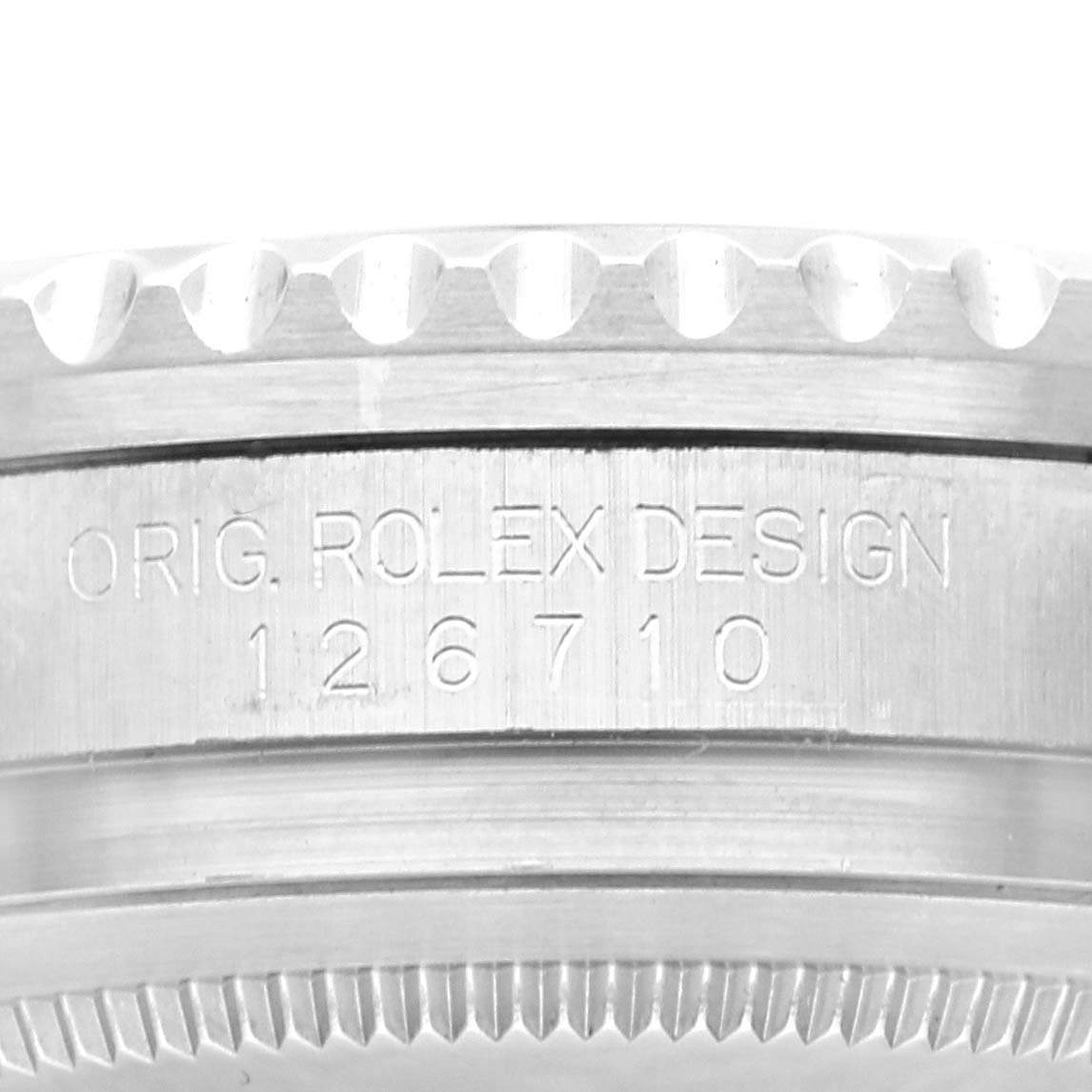 The image shows a close-up of the case side of a Rolex GMT-Master 126710 Men
s Stainless Steel Black Dial 126710 Men
s Stainless Steel Black Dial, displaying the model number and "ORIG. ROLEX DESIGN."
