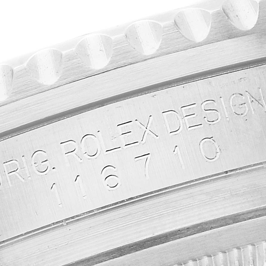 The image shows an angled close-up of the engraved side of a Rolex GMT-Master 116710 Men's Stainless Steel Black Dial 116710 Men's Stainless Steel Black Dial model, highlighting the model number 116710.