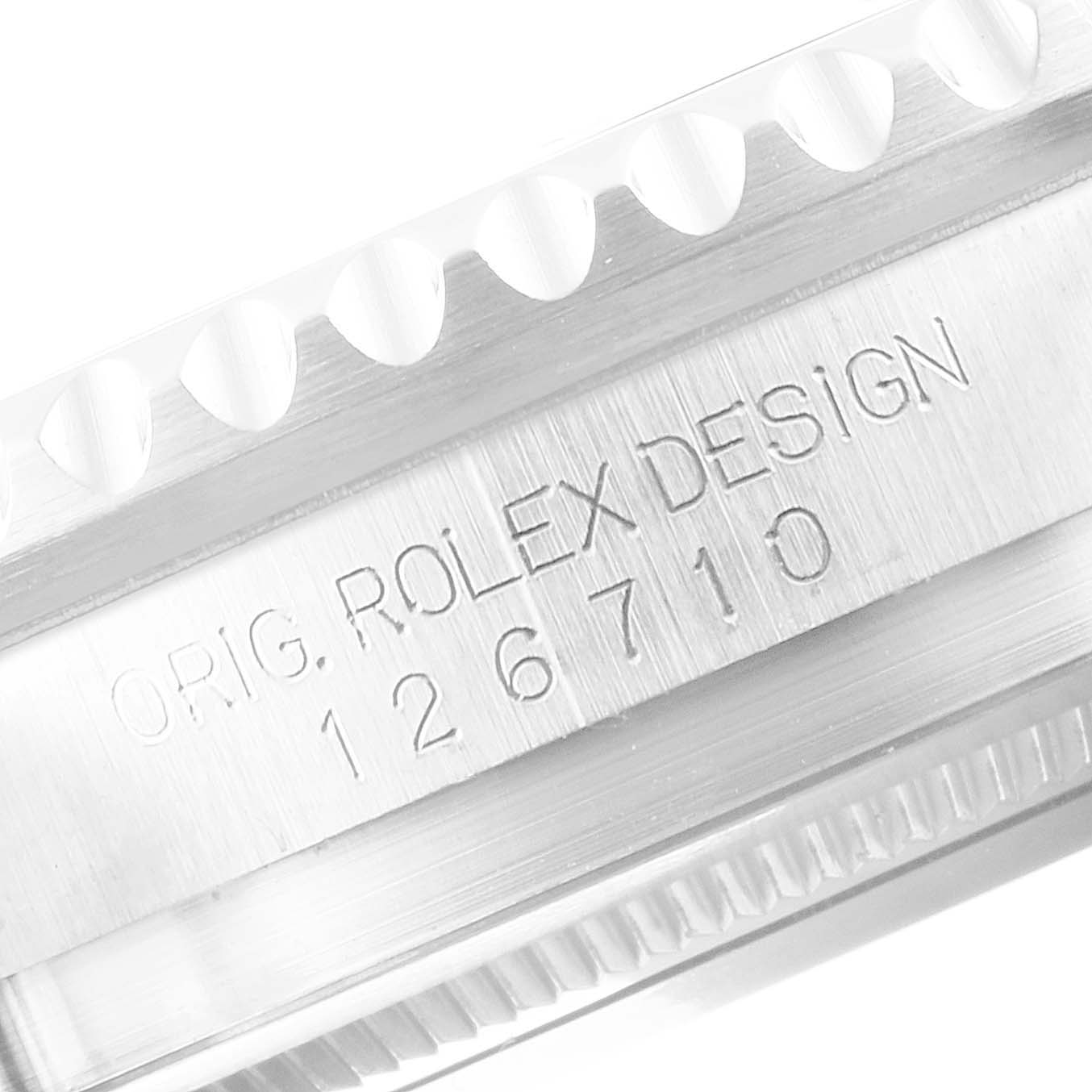 The image shows a close-up of the case side of a Rolex GMT-Master 126710 Men
s Stainless Steel Black Dial 126710 Men
s Stainless Steel Black Dial, displaying the model number 126710 and text "ORIG. ROLEX DESIGN."