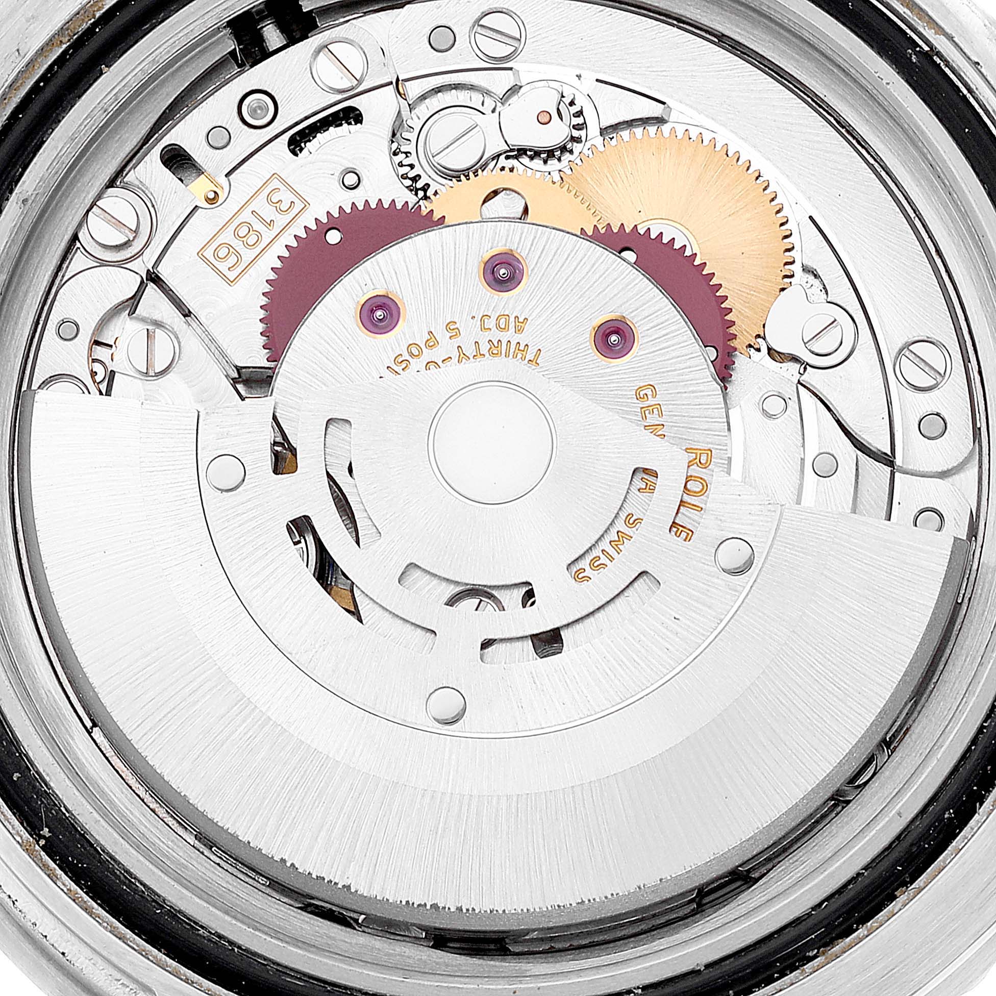 This image shows the intricate inner mechanism of a Rolex GMT-Master 116710 Men's Stainless Steel Black Dial 116710 Men's Stainless Steel Black Dial watch, specifically focusing on the movement components.