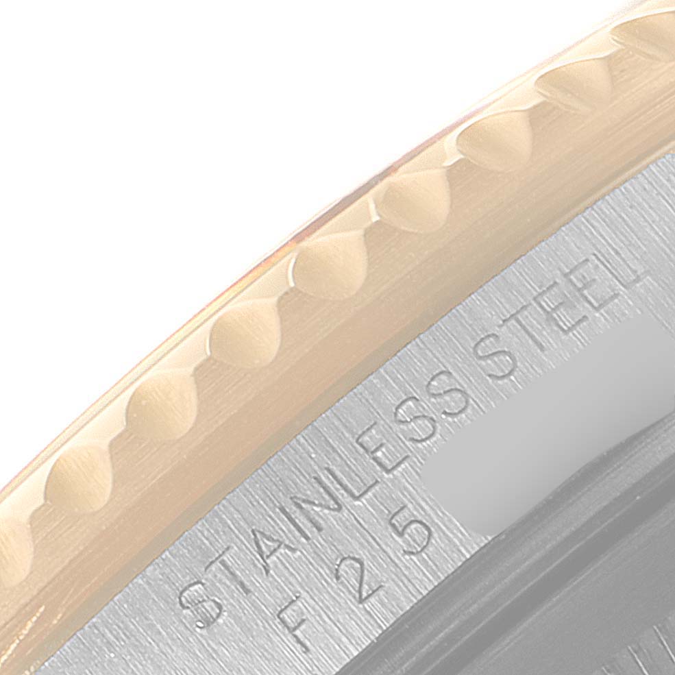 The image shows a close-up angle of the stainless steel case back and bezel teeth of a Rolex GMT-Master 16713 Men's Steel and Gold (two tone) Brown Dial 16713 Men's Steel and Gold (two tone) Brown Dial watch.