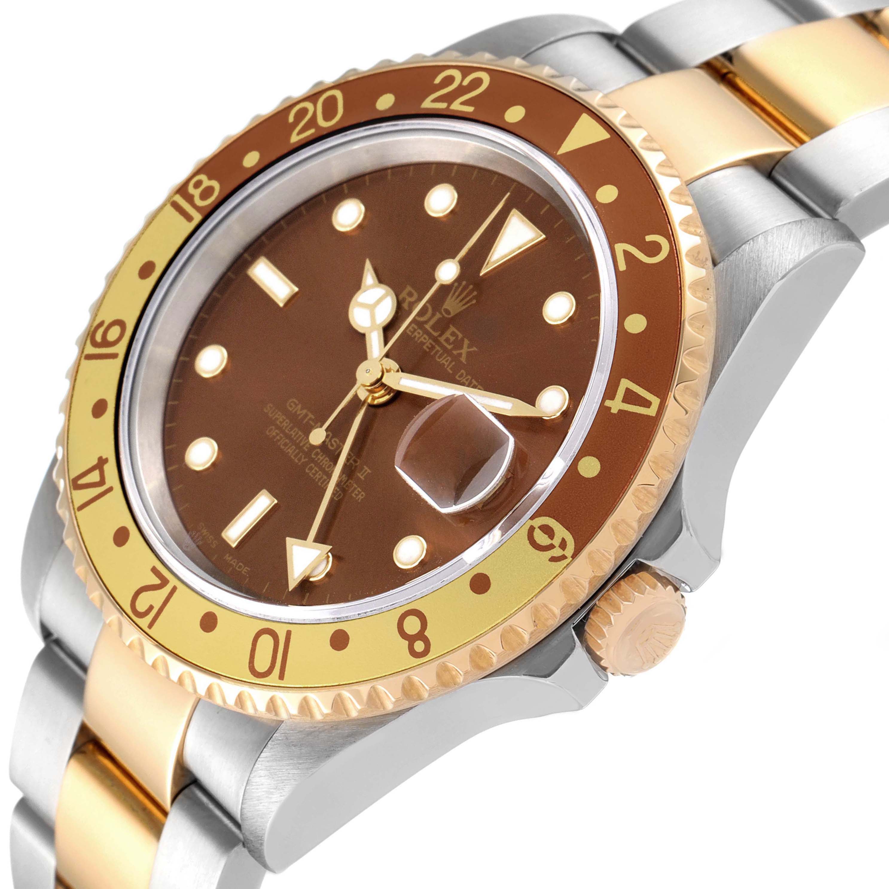 The image shows a close-up of a Rolex GMT-Master 16713 Men's Steel and Gold (two tone) Brown Dial 16713 Men's Steel and Gold (two tone) Brown Dial, highlighting the brown dial, gold bezel, and two-tone bracelet.