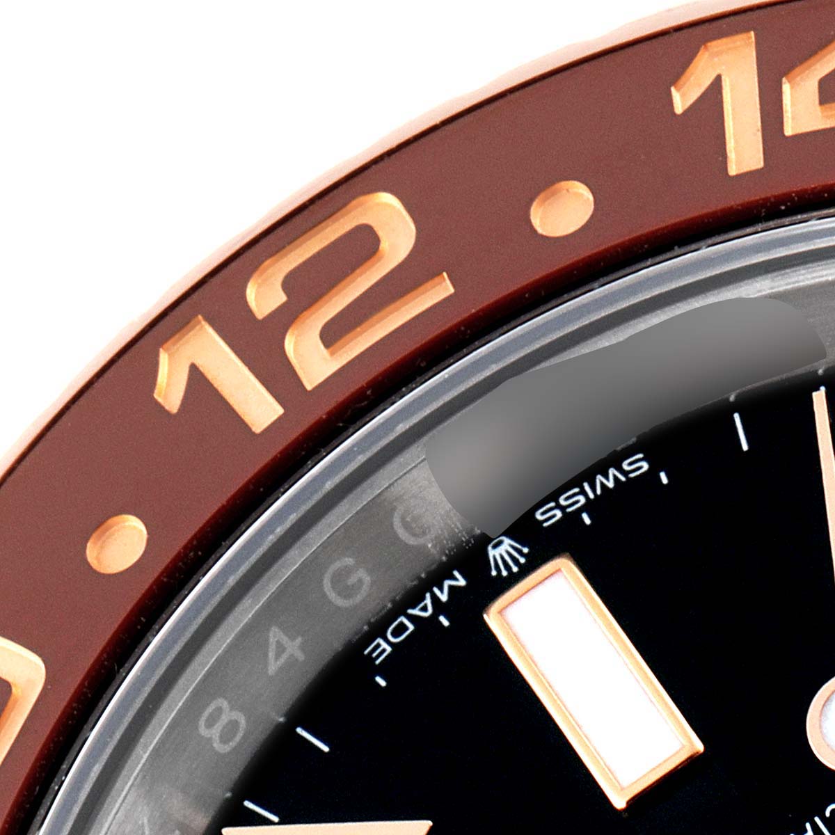 The image shows a close-up of the bezel, dial, and part of the "Swiss Made" marking of a Rolex GMT-Master 126711CHNR Men's Steel and Gold (two tone) Black Dial 126711CHNR Men's Steel and Gold (two tone) Black Dial watch.
