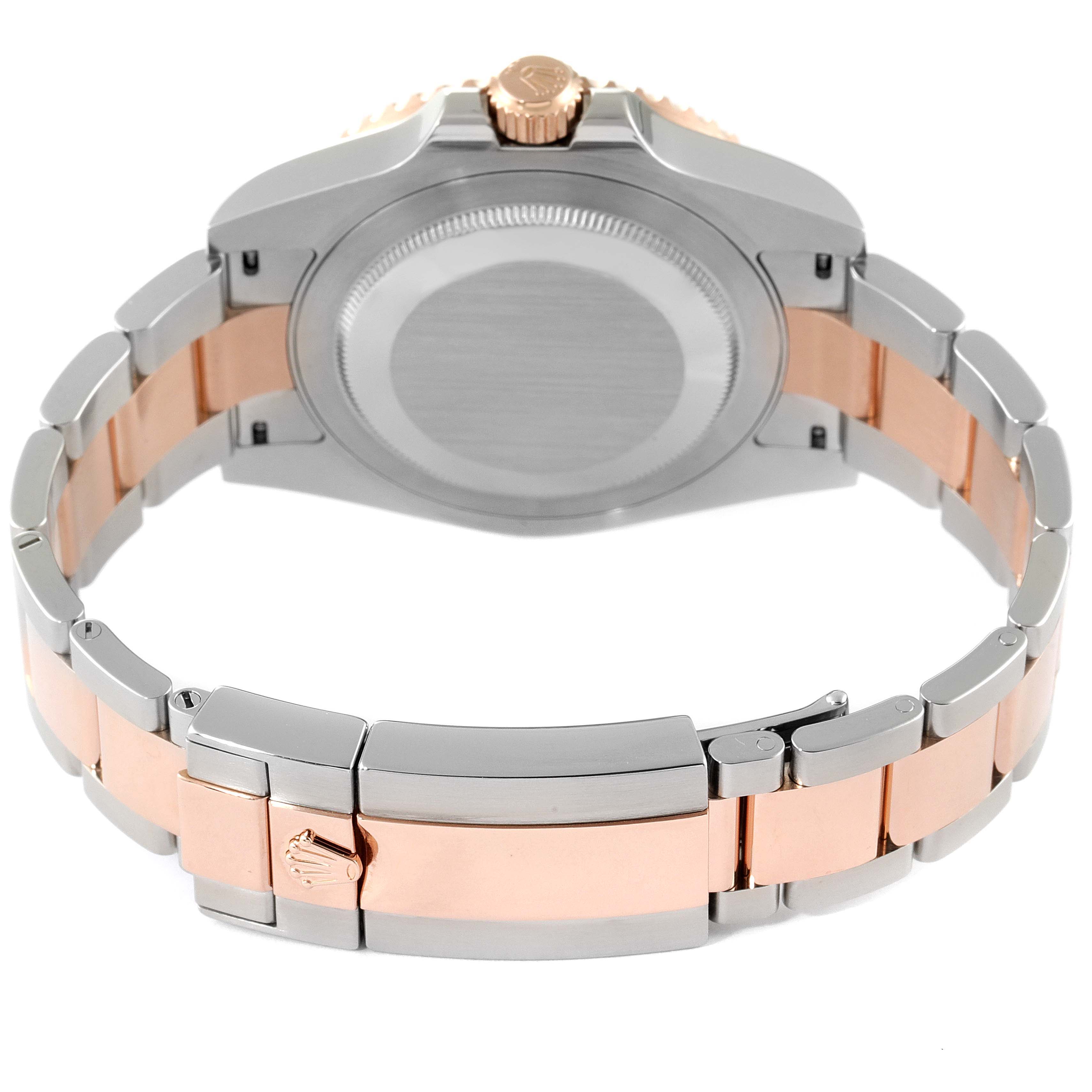 The image shows the back view of a Rolex GMT-Master 126711CHNR Men's Steel and Gold (two tone) Black Dial 126711CHNR Men's Steel and Gold (two tone) Black Dial watch, highlighting the case back, crown, and two-tone metal bracelet.