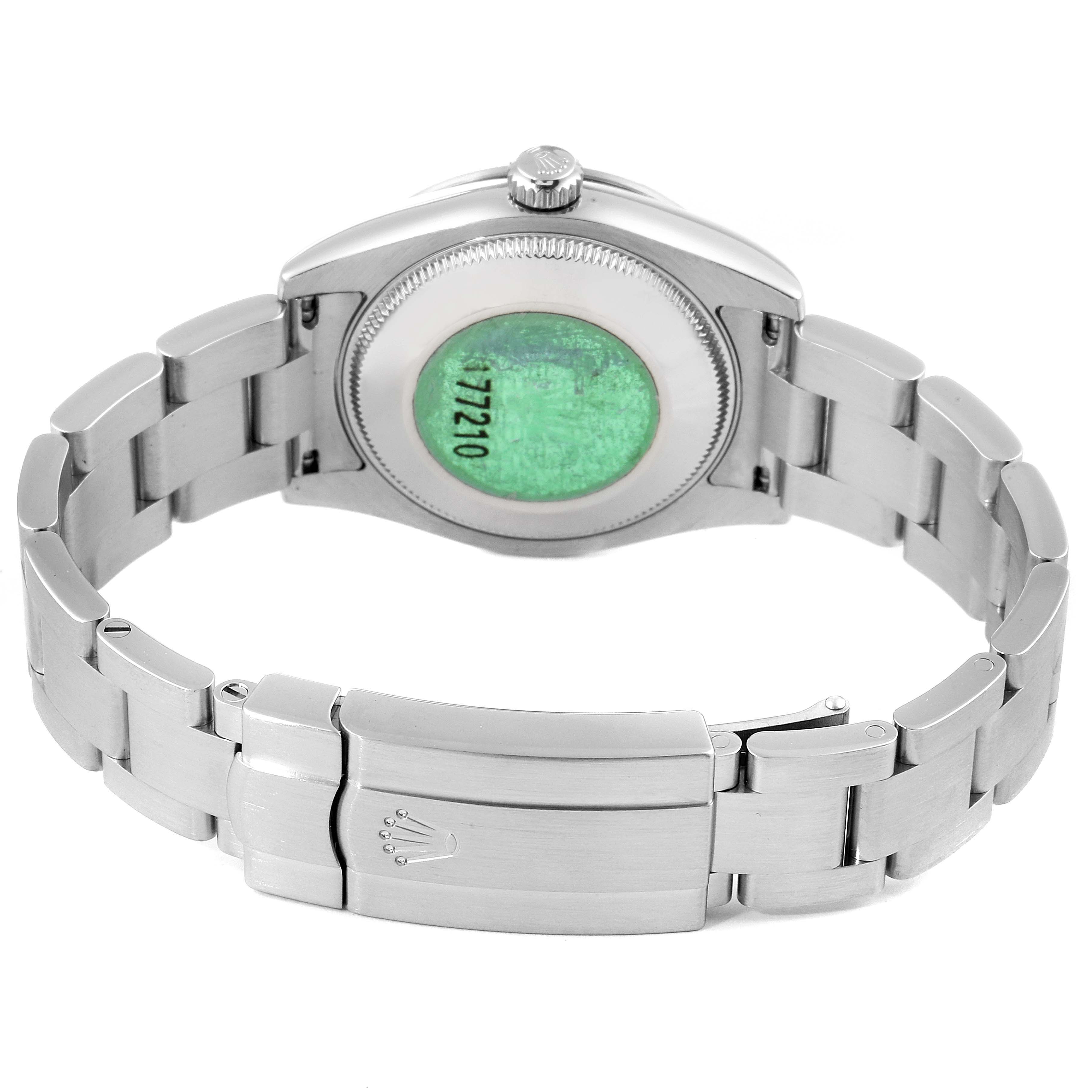 This image shows the back and bracelet of a Mid-Size Rolex watch from a rear angle.