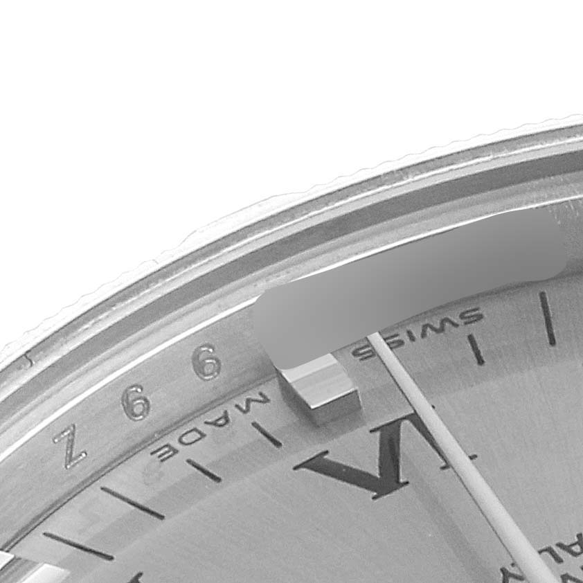 This image shows a close-up of the dial and bezel of a Mid-Size Rolex watch.