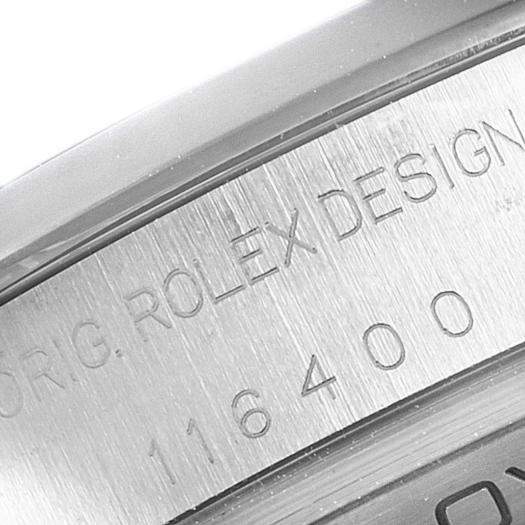 This close-up image shows the engraved case side of a Rolex Milgauss 116400 Men
s Stainless Steel Black Dial 116400 Men
s Stainless Steel Black Dial, including part of the model number and branding.