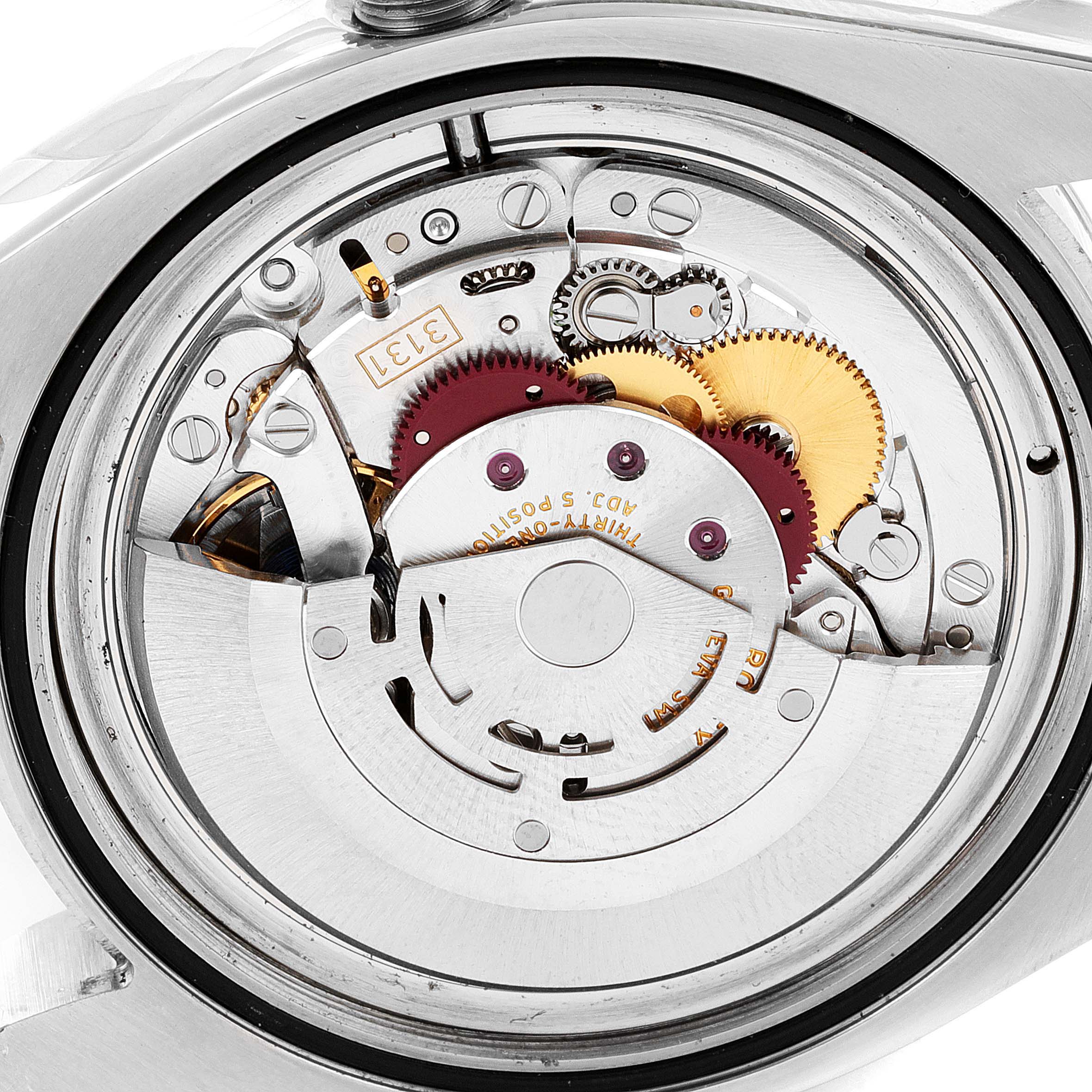 The image shows the internal mechanism of a Rolex Milgauss 116400V Men
s Stainless Steel Black Dial 116400V Men
s Stainless Steel Black Dial watch from a close-up, top-down angle.