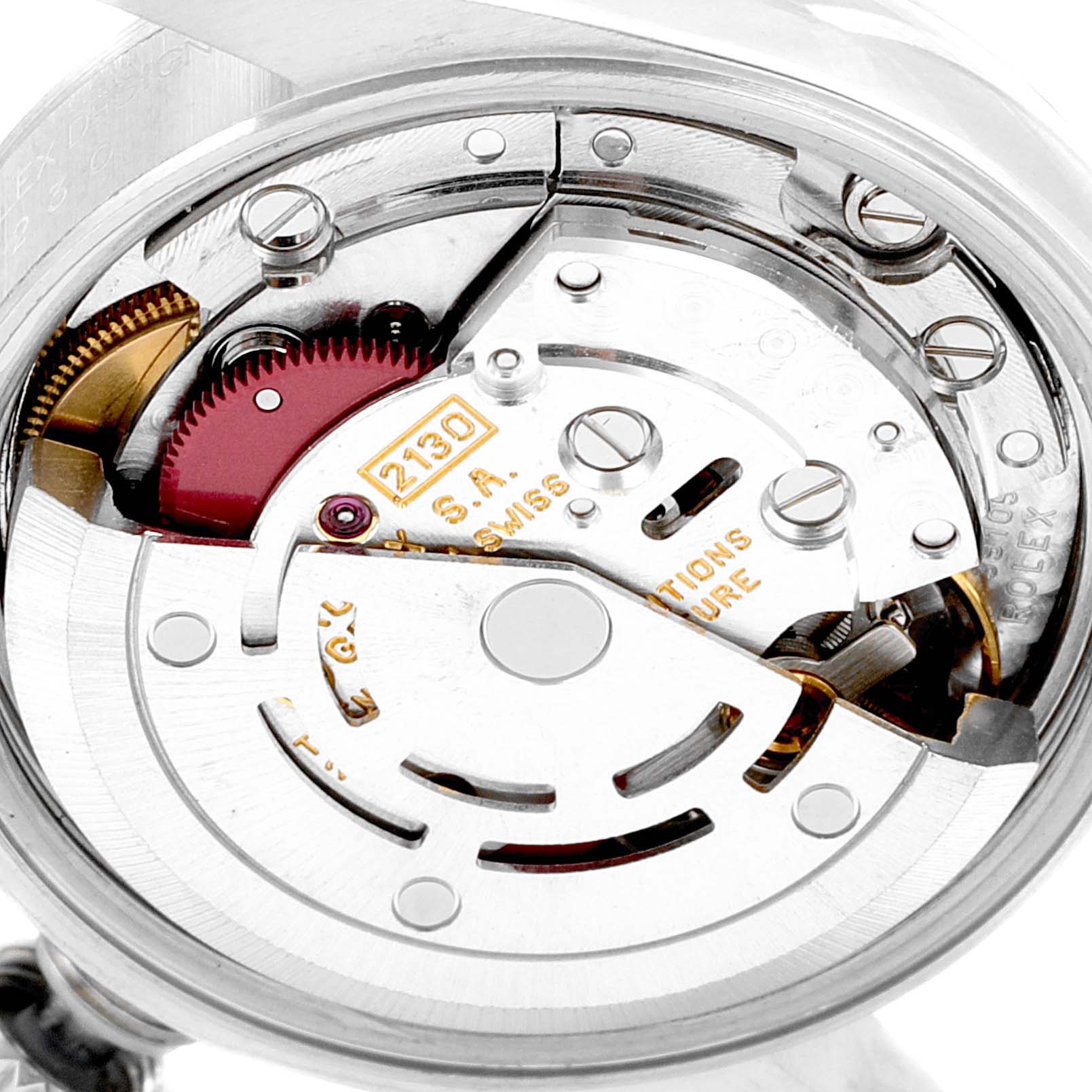 This close-up image shows the intricate inner mechanism of a Rolex Oyster Perpetual 67230 Women's Stainless Steel Black Dial 67230 Women's Stainless Steel Black Dial watch.