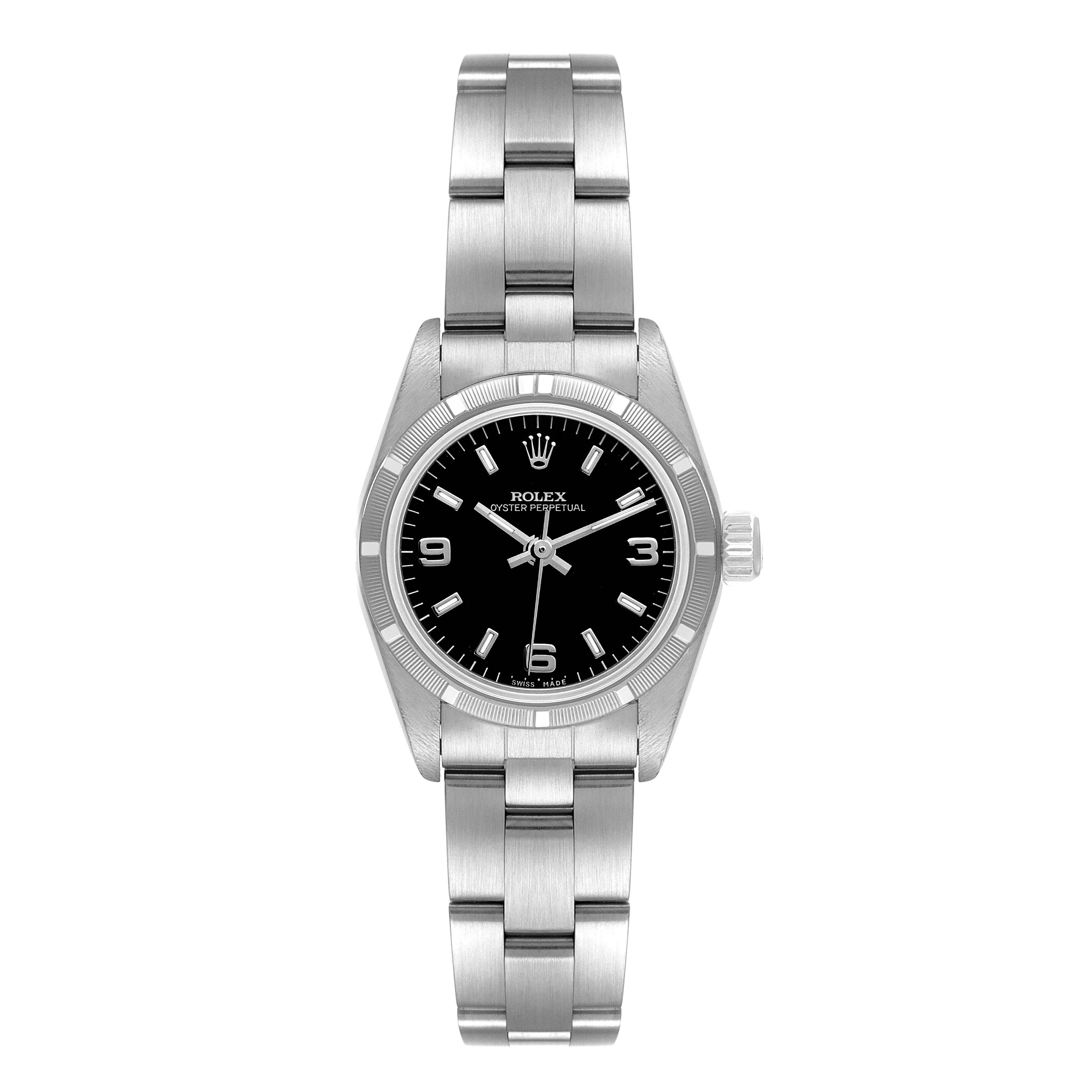 The image shows a front view of the Rolex Oyster Perpetual 67230 Women's Stainless Steel Black Dial 67230 Women's Stainless Steel Black Dial watch, featuring its bracelet, dial, and bezel.