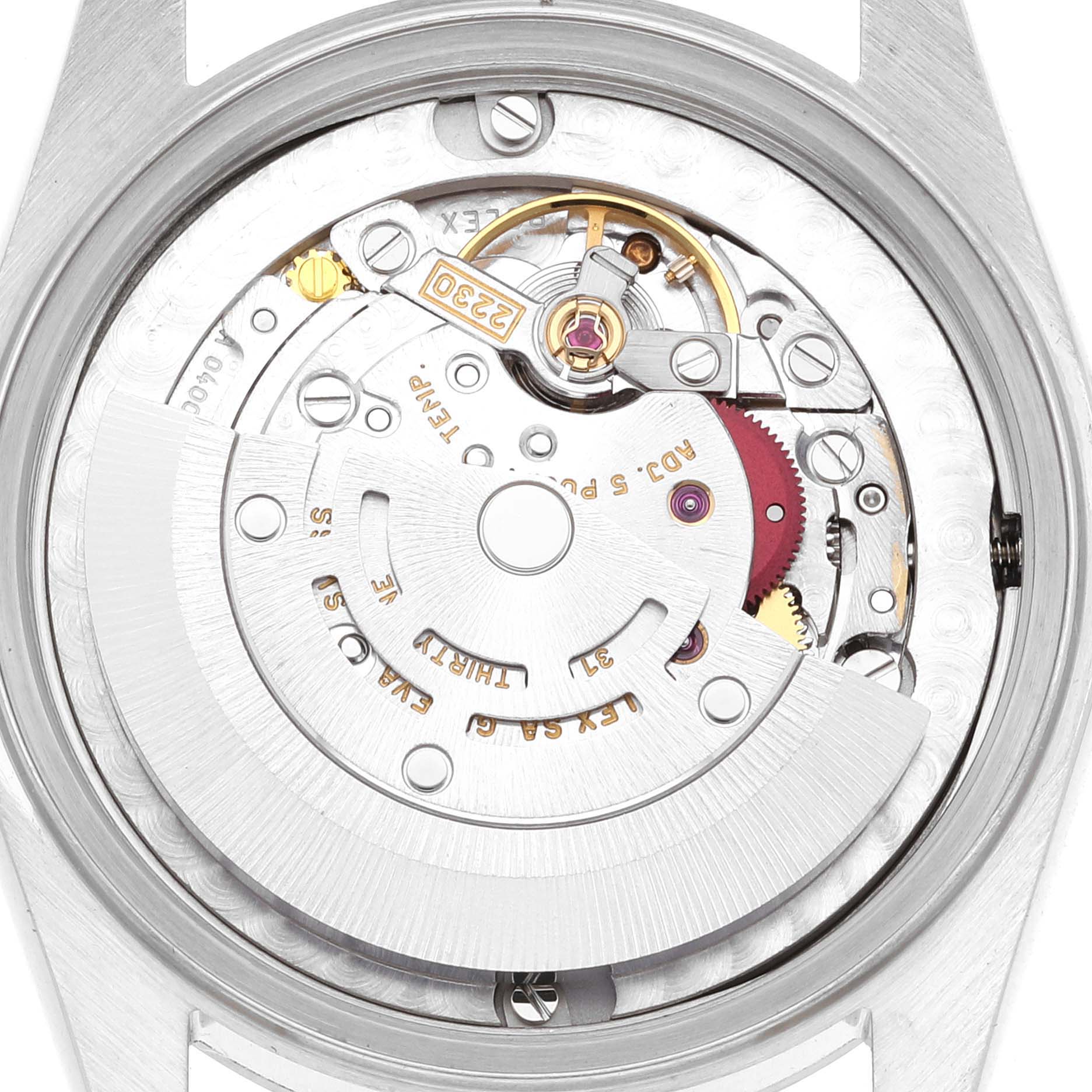 The image shows the internal mechanism of a Mid-Size Rolex watch at a top-down angle, highlighting the movement components.