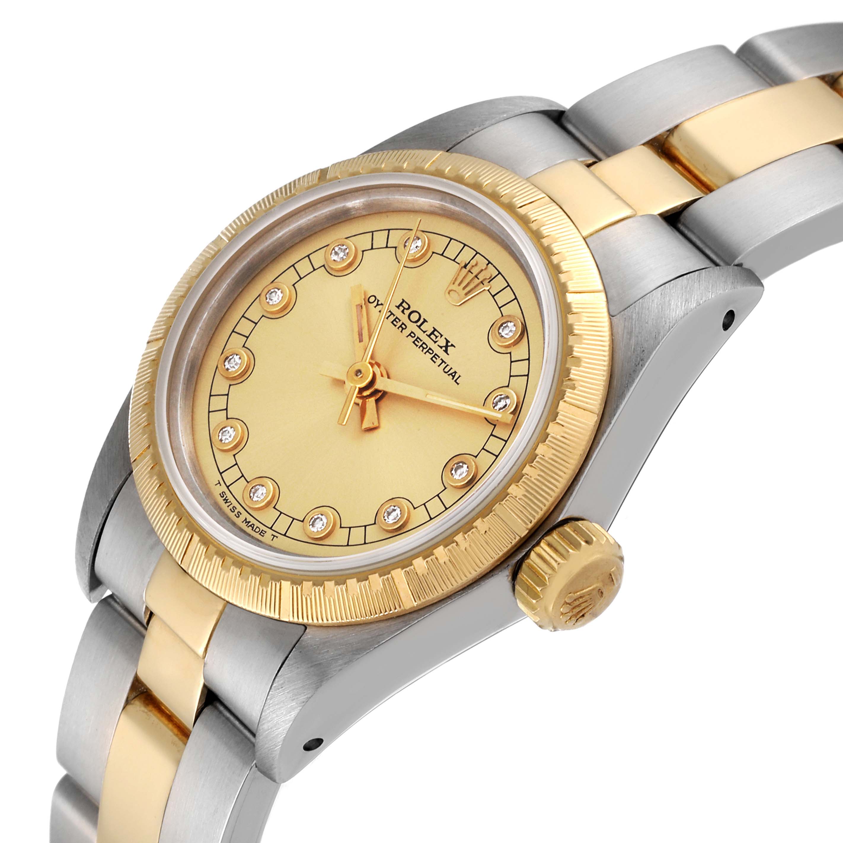 This image shows a Rolex Oyster Perpetual 67243 Women's Steel and Gold (two tone) Champagne Dial 67243 Women's Steel and Gold (two tone) Champagne Dial watch from a front-side angle, displaying the dial, bezel, case, and part of the bracelet.