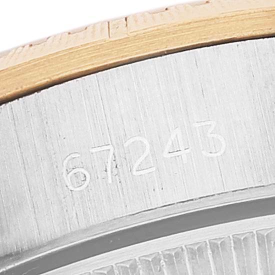 This close-up angle of the Rolex Oyster Perpetual 67243 Women's Steel and Gold (two tone) Champagne Dial 67243 Women's Steel and Gold (two tone) Champagne Dial shows part of the case with the model number "67243" engraved.