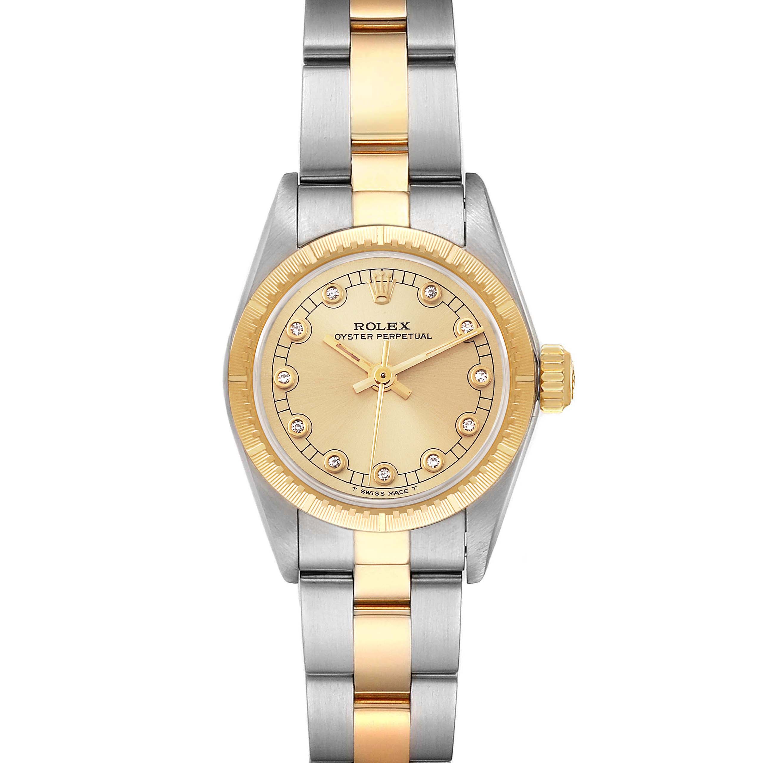 This Rolex Oyster Perpetual 67243 Women's Steel and Gold (two tone) Champagne Dial 67243 Women's Steel and Gold (two tone) Champagne Dial watch is shown from the front, displaying the face, bezel, and two-tone band.