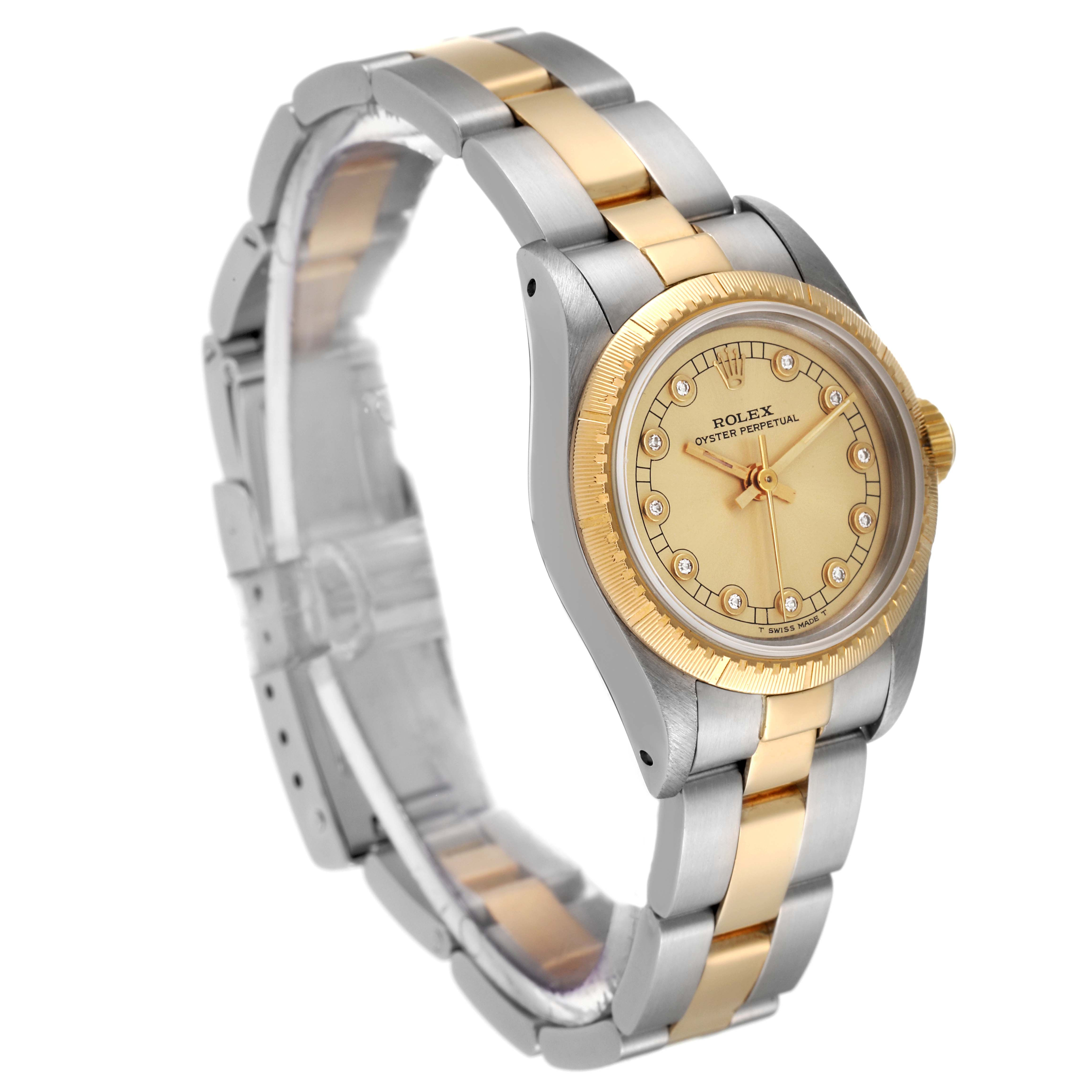 This image shows a side angle of the Rolex Oyster Perpetual 67243 Women's Steel and Gold (two tone) Champagne Dial 67243 Women's Steel and Gold (two tone) Champagne Dial watch, displaying the bracelet, case, and dial.
