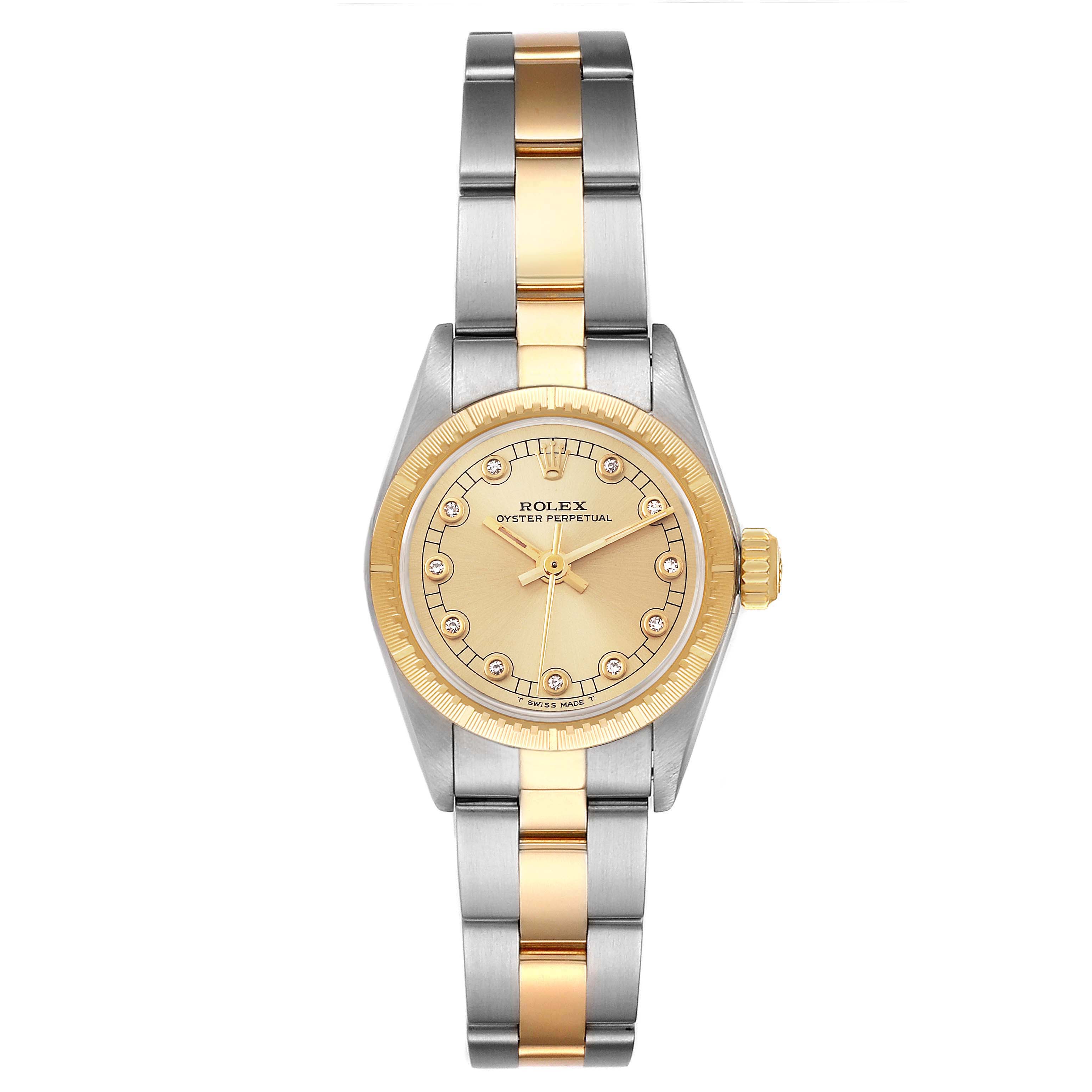 The image shows a front view of the Rolex Oyster Perpetual 67243 Women's Steel and Gold (two tone) Champagne Dial 67243 Women's Steel and Gold (two tone) Champagne Dial watch, highlighting its dial, bezel, and two-tone metal bracelet.