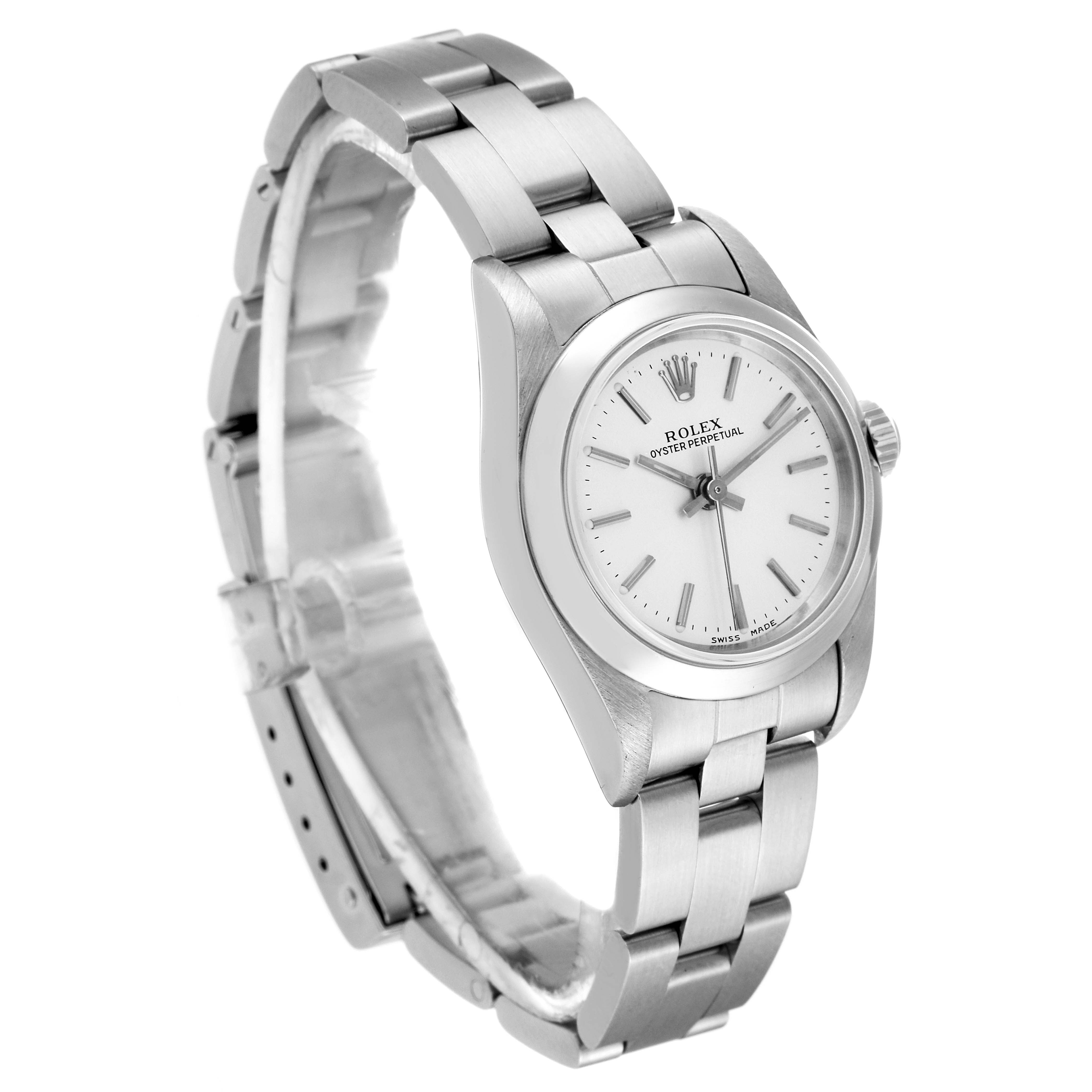 The Rolex Oyster Perpetual 76080 Women's Stainless Steel Silver Dial 76080 Women's Stainless Steel Silver Dial watch is shown at an oblique angle, capturing the dial, bezel, and bracelet.