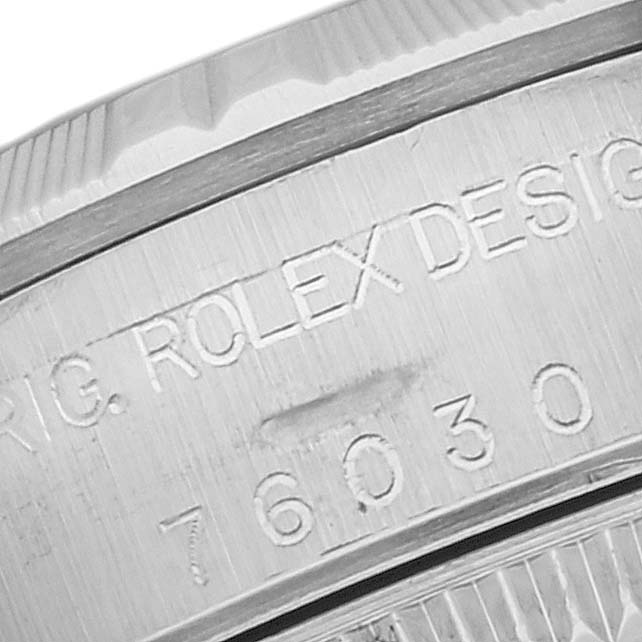 This image shows a close-up of the engraved model number and branding on the side of a Rolex Oyster Perpetual 76030 Women's Stainless Steel Pink Dial 76030 Women's Stainless Steel Pink Dial watch.