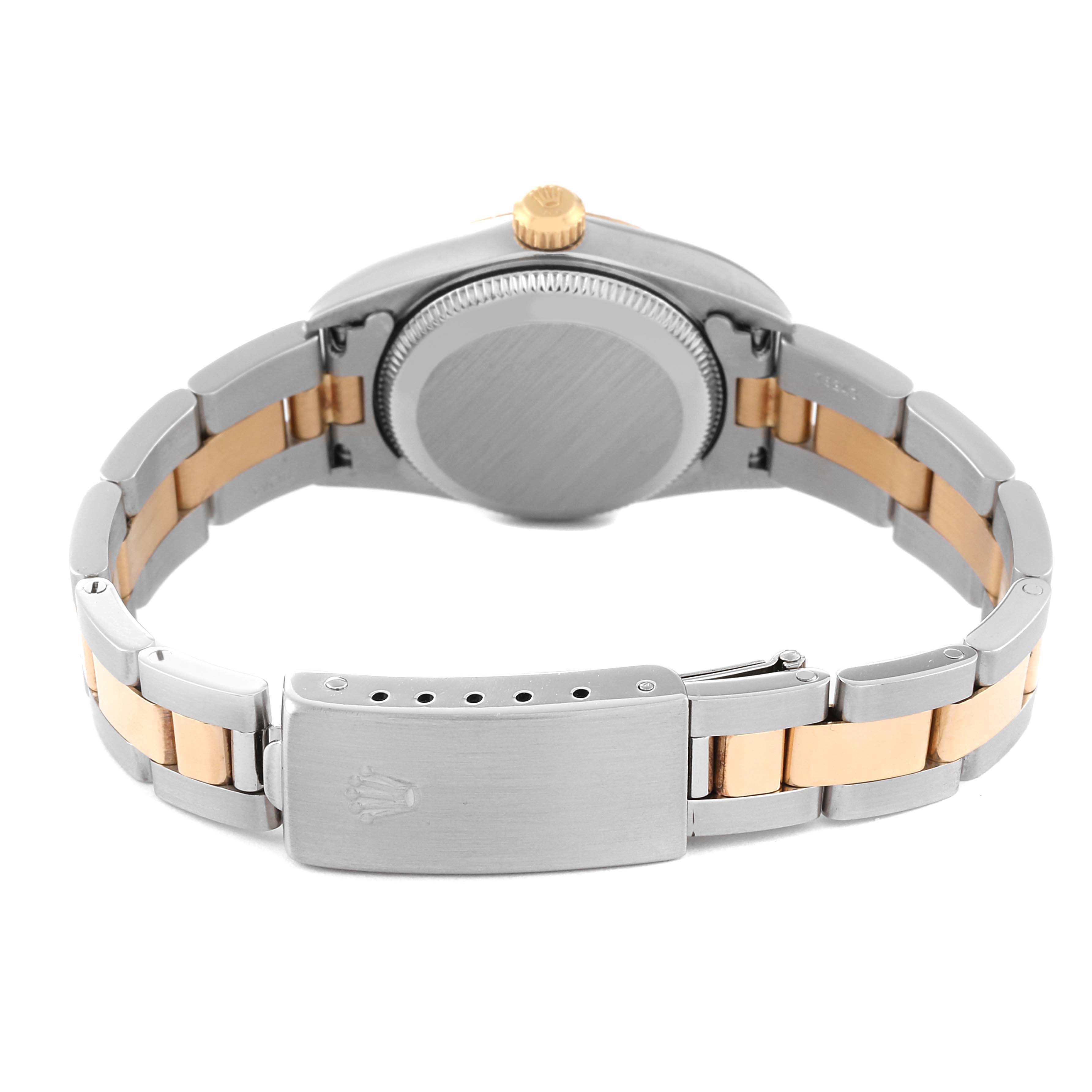 The image shows the back view of the Rolex Oyster Perpetual 76193 Women's Steel and Gold (two tone) Champagne Dial 76193 Women's Steel and Gold (two tone) Champagne Dial watch, highlighting the case back, crown, and two-tone bracelet.