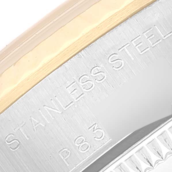 This close-up image shows the "STAINLESS STEEL" engraving on the side of the Rolex Oyster Perpetual 76193 Women's Steel and Gold (two tone) Champagne Dial 76193 Women's Steel and Gold (two tone) Champagne Dial watch.