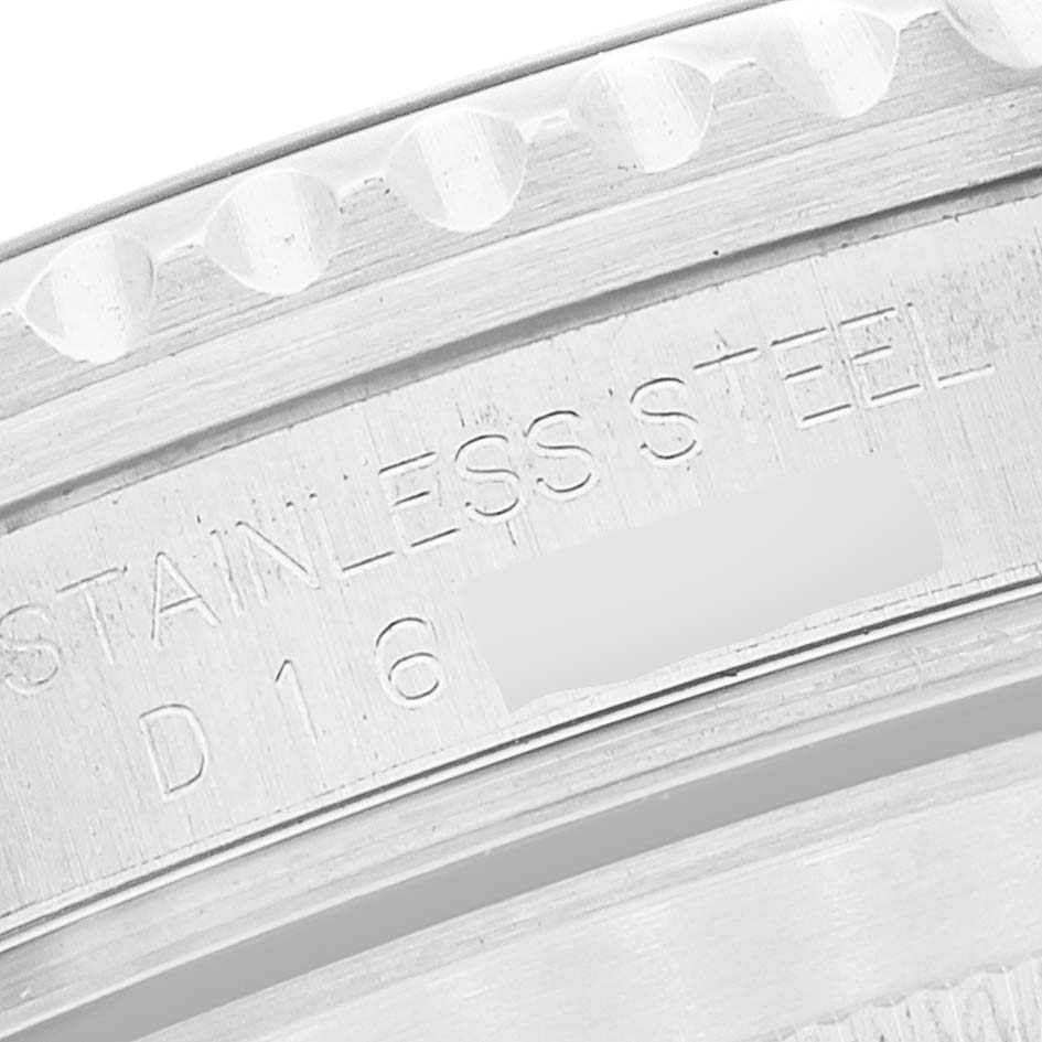 This close-up image shows the engraved bezel and caseback of a Rolex Submariner 16610 Men's Stainless Steel Black Dial 16610 Men's Stainless Steel Black Dial watch, highlighting the "STAINLESS STEEL" inscription.