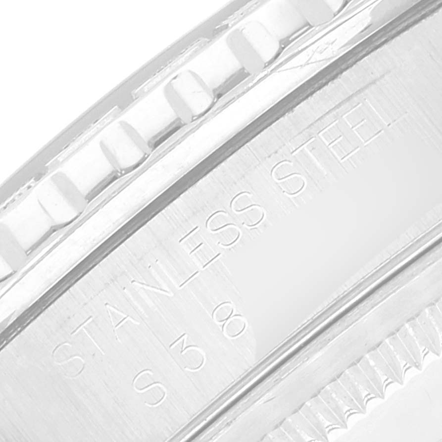 This image shows a close-up of the bezel and part of the casing with engravings on a Rolex Turn-o-Graph 16264 Men
s Stainless Steel Blue Dial 16264 Men
s Stainless Steel Blue Dial watch.