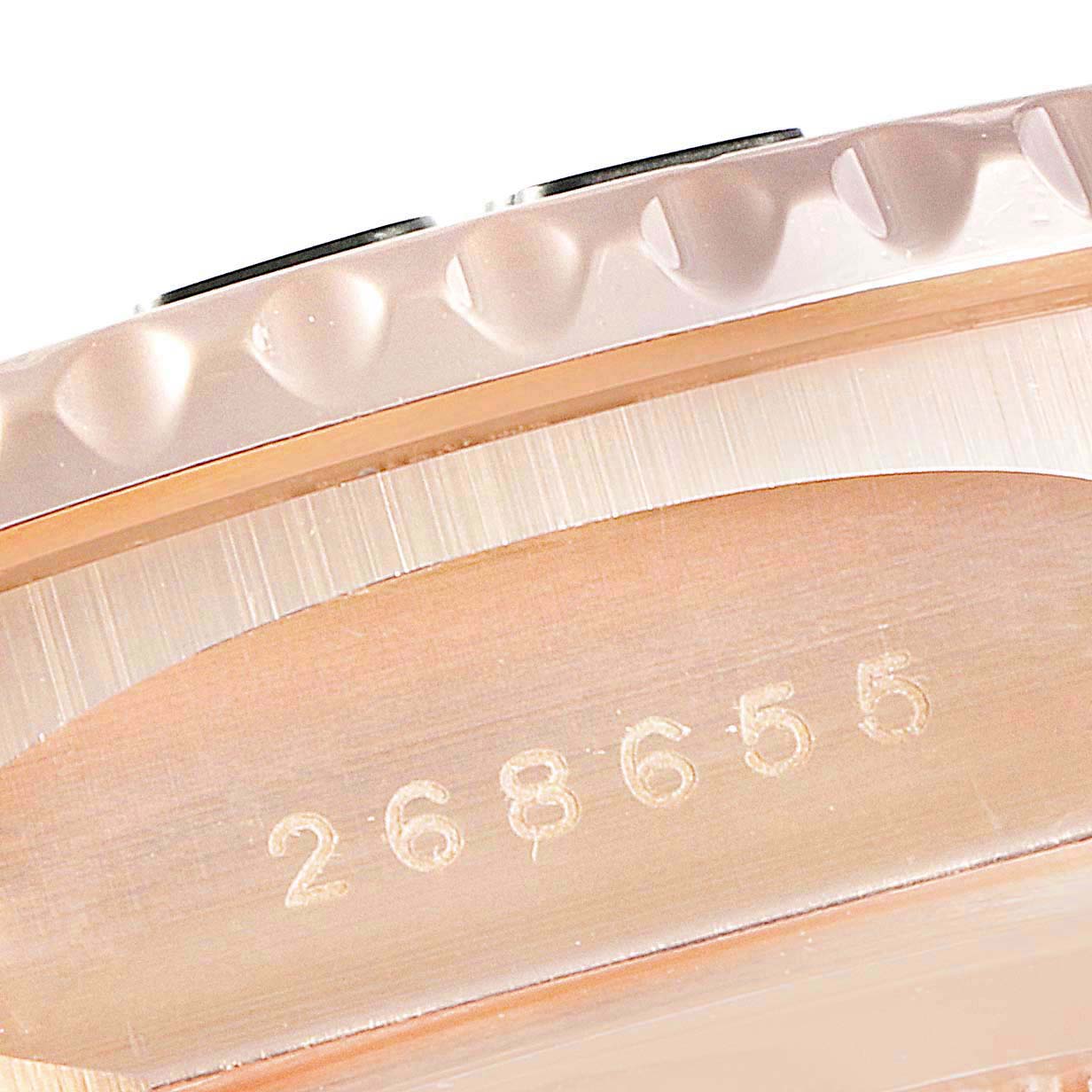This close-up image shows the bezel and serial number of a Rolex Yacht-Master 268655 Men
s Rose Gold Black Dial 268655 Men
s Rose Gold Black Dial watch.