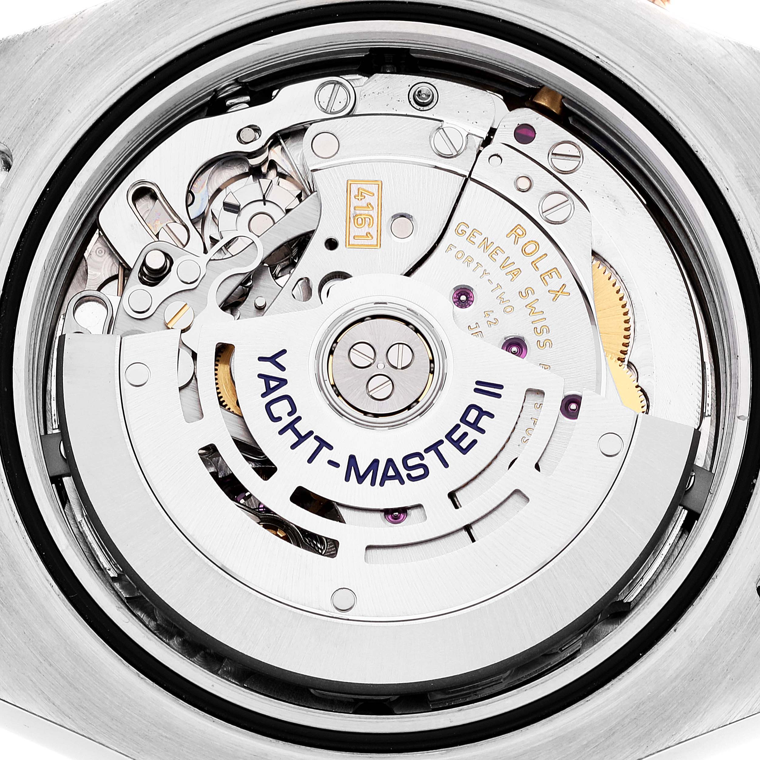 The image shows a close-up view of the Rolex Yacht-Master 116681 Men
s Steel and Gold (two tone) White Dial 116681 Men
s Steel and Gold (two tone) White Dial II
s movement mechanism and its engraved rotor.
