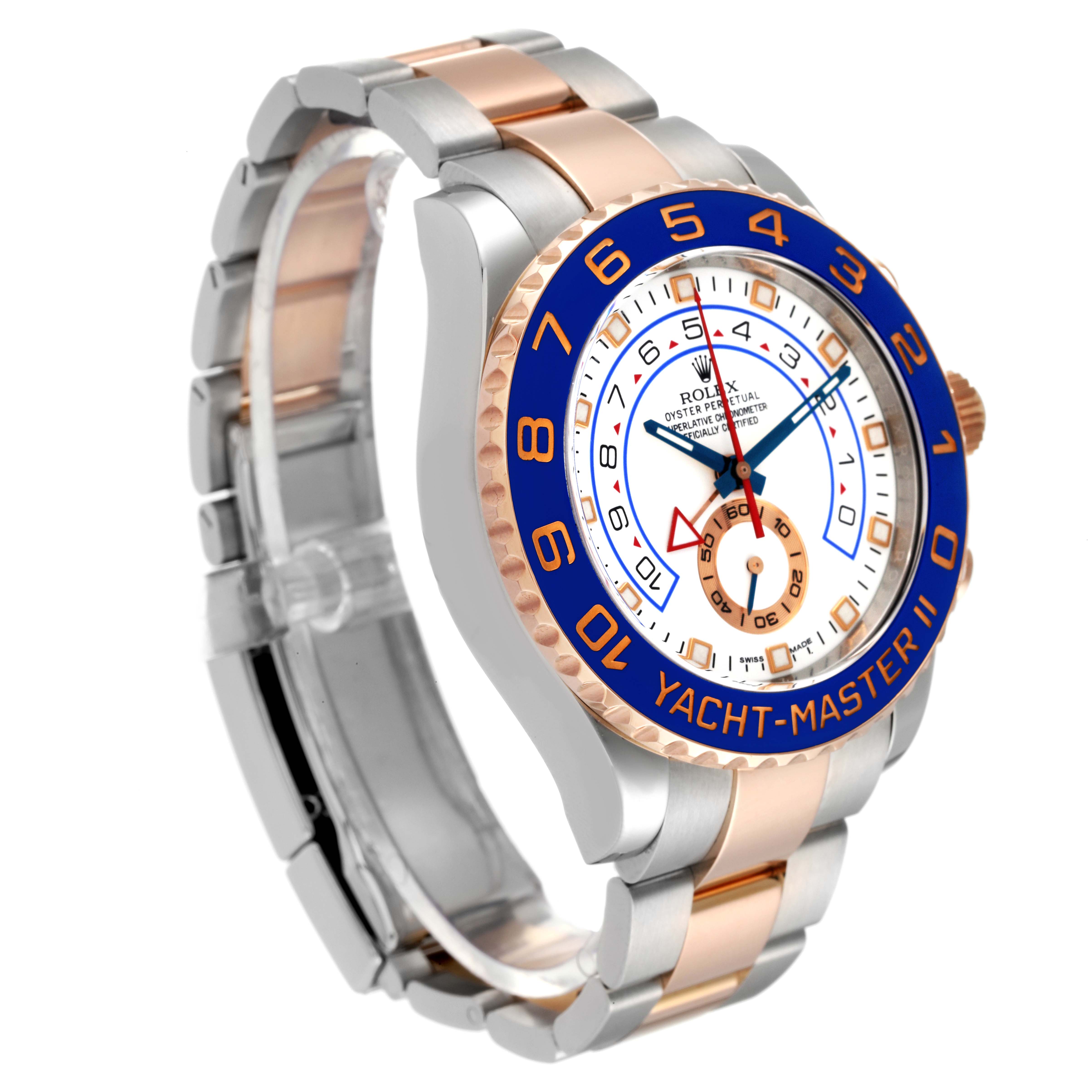 The image shows a Rolex Yacht-Master 116681 Men
s Steel and Gold (two tone) White Dial 116681 Men
s Steel and Gold (two tone) White Dial II watch, angled to display the face, bezel, and part of the metal bracelet.