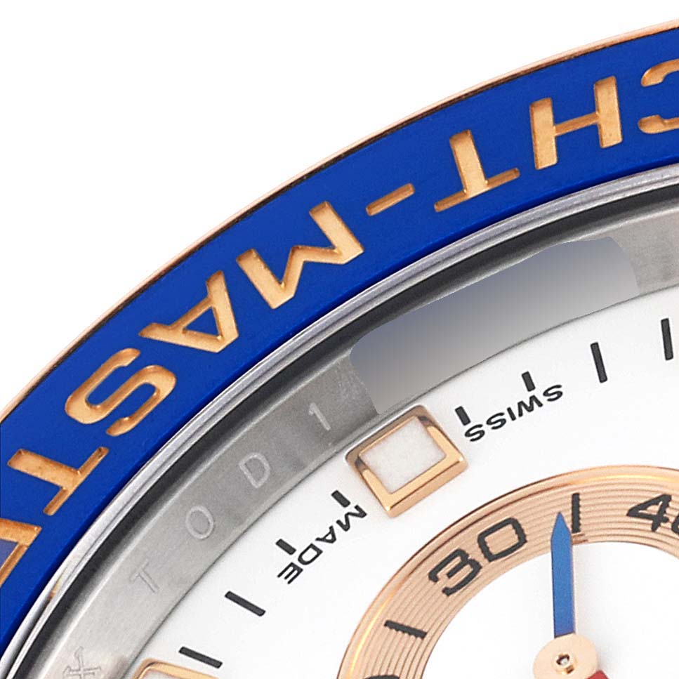 This image shows a partial close-up of the dial and bezel of a Rolex Yacht-Master 116681 Men
s Steel and Gold (two tone) White Dial 116681 Men
s Steel and Gold (two tone) White Dial watch.