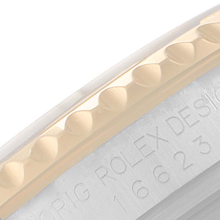 This image shows a close-up of the bezel and part of the case of a Rolex Yacht-Master 16623 Men
s Steel and Gold (two tone) White Dial 16623 Men
s Steel and Gold (two tone) White Dial watch.