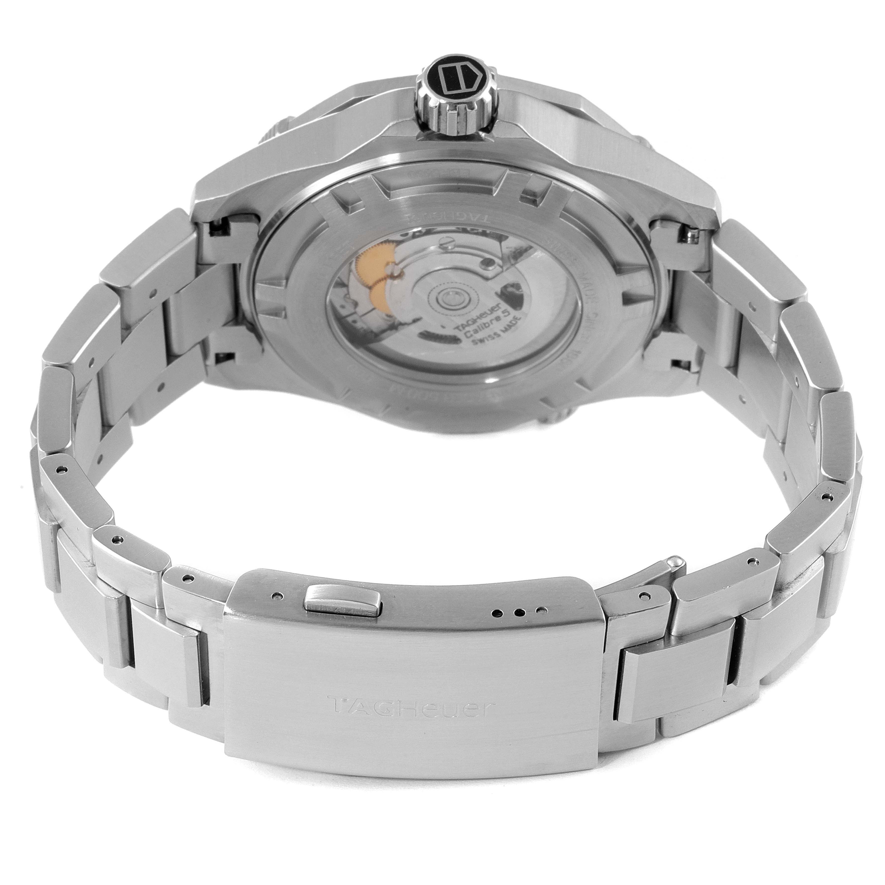 The image shows the back of a Tag Heuer Aquaracer WAJ2111.BA0870 Men's Stainless Steel Grey Dial WAJ2111.BA0870 Men's Stainless Steel Grey Dial watch, highlighting its clasp, bracelet, and automatic movement through the transparent case back.