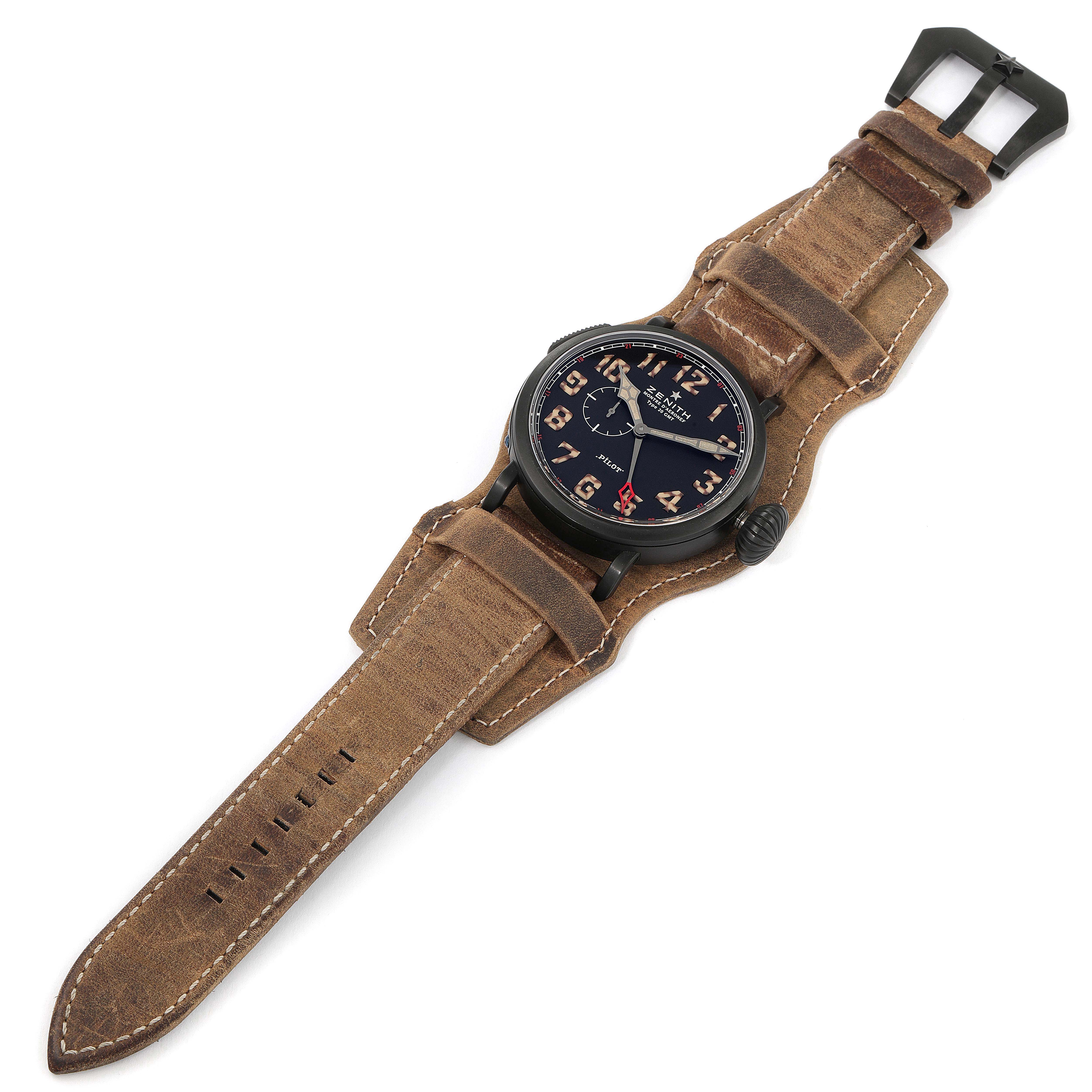 This Pilot watch by Zenith is shown at a slight angle, displaying its face, brown leather strap, and buckle.