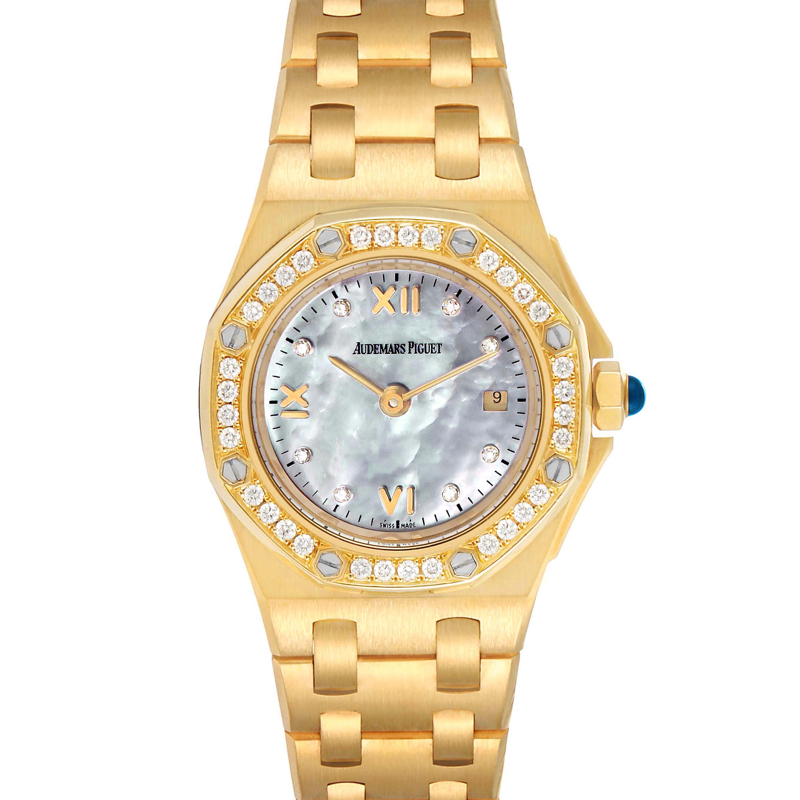 The image shows a frontal view of an Audemars Piguet Royal Oak Offshore 67151BA.ZZ.1108BA.01 Women's Yellow Gold Mother of Pearl Dial 67151BA.ZZ.1108BA.01 Women's Yellow Gold Mother of Pearl Dial watch, highlighting its gold case, bracelet, and diamond-set bezel.