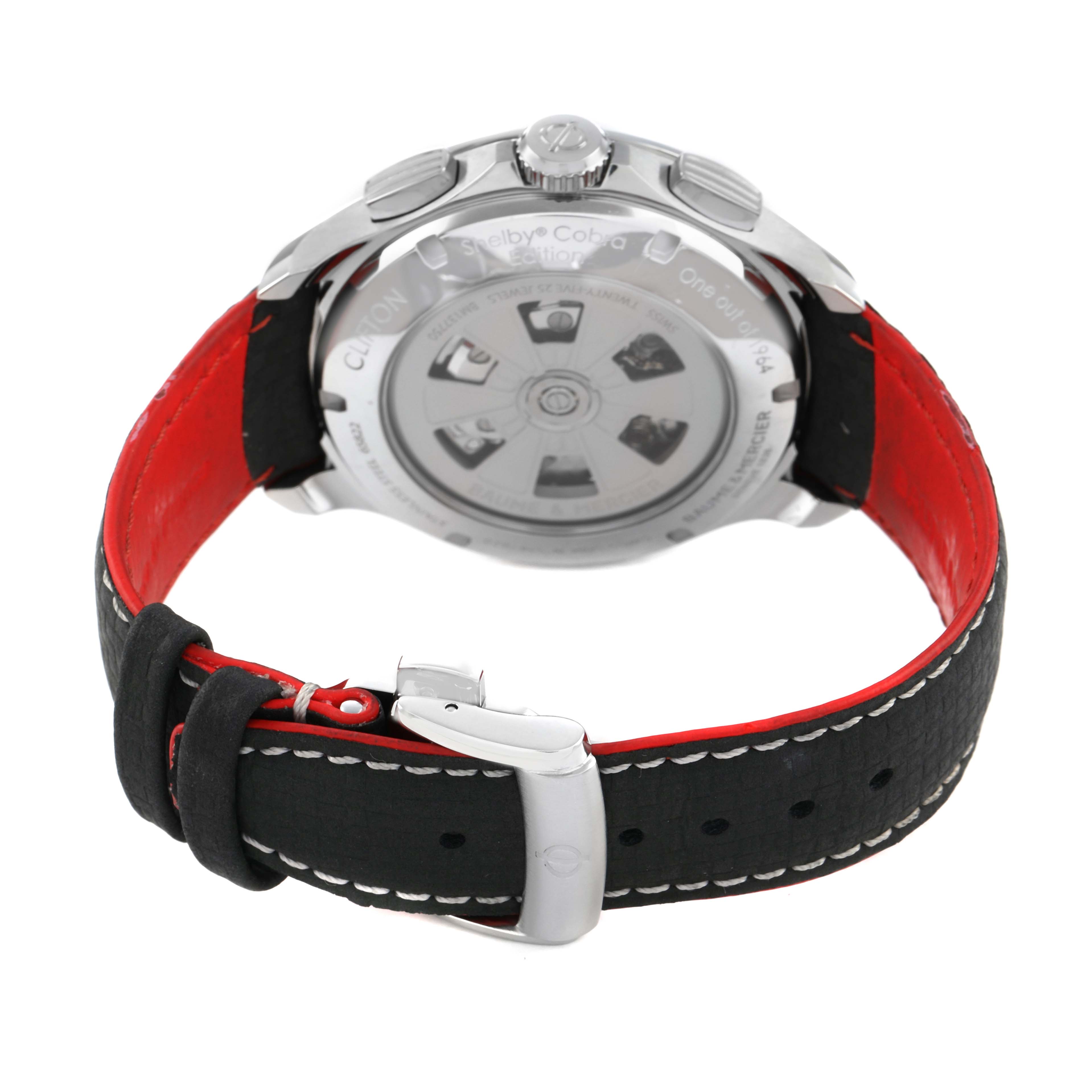 The Baume & Mercier Clifton 65822 Men's Stainless Steel Blue Dial watch is shown from the back, displaying its case back, buckle, and strap with stitching details.